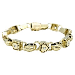 Bracelet à maillons carrés et en forme de cœur alternant avec diamants en or jaune 14 carats