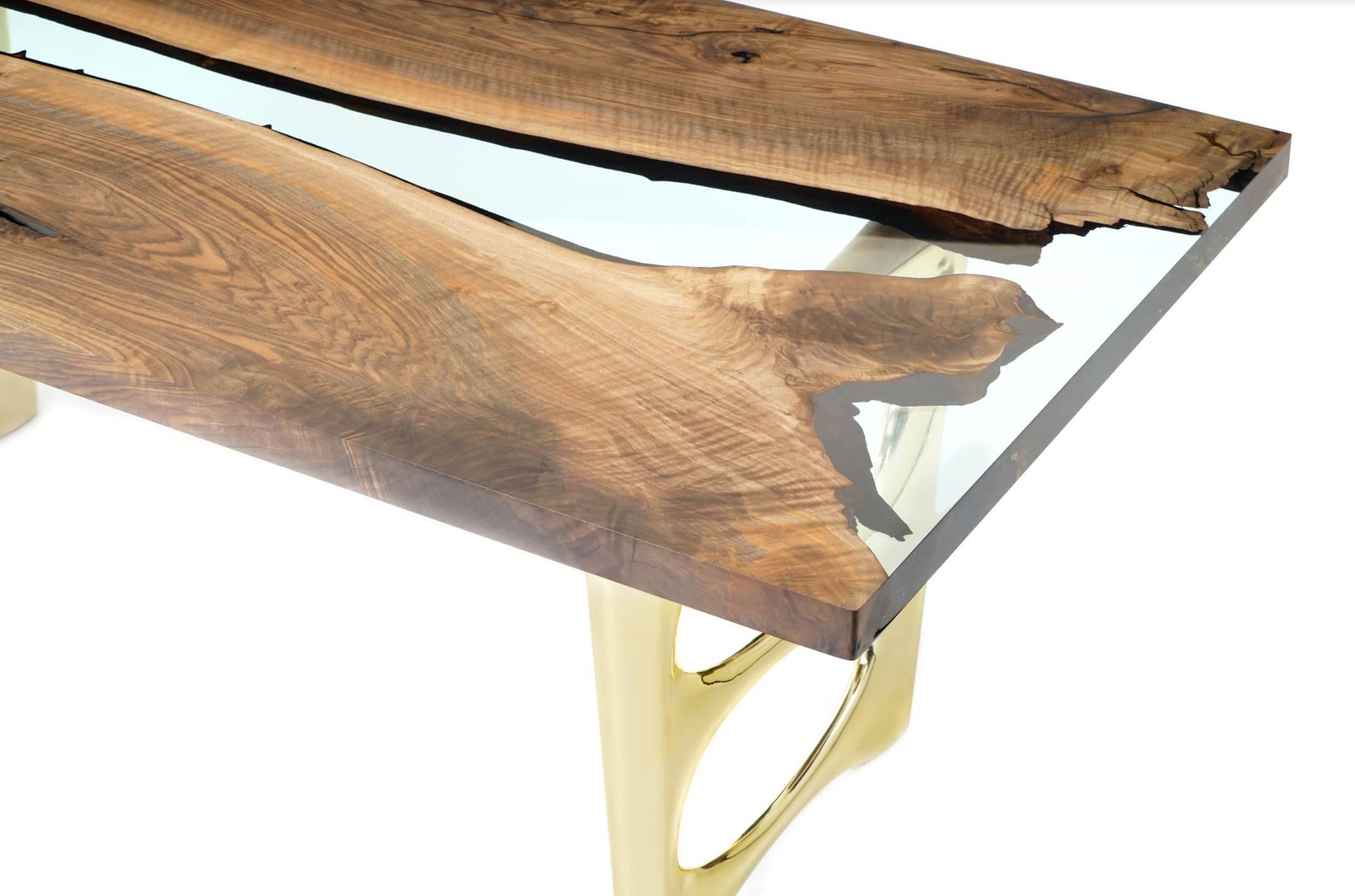 The ‘Altin 200 Epoxy Resin Dining Table’ was made in Ankara, Turkey with the most durable walnut wood. The wood is kilned and dried prior to being filled with high quality epoxy and has a robust chrome base with a gold finish. Its edges are straight