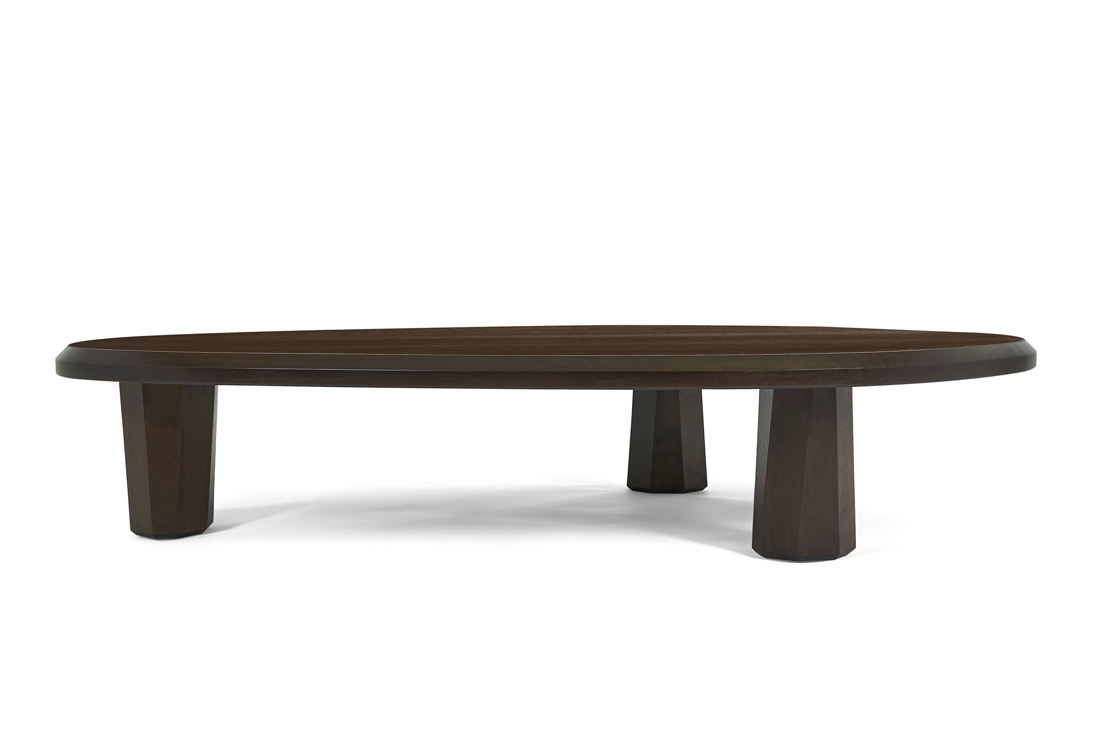 Sturdy and sophisticated, the alto coffee table features asymmetrical lines and a rich finish on walnut.