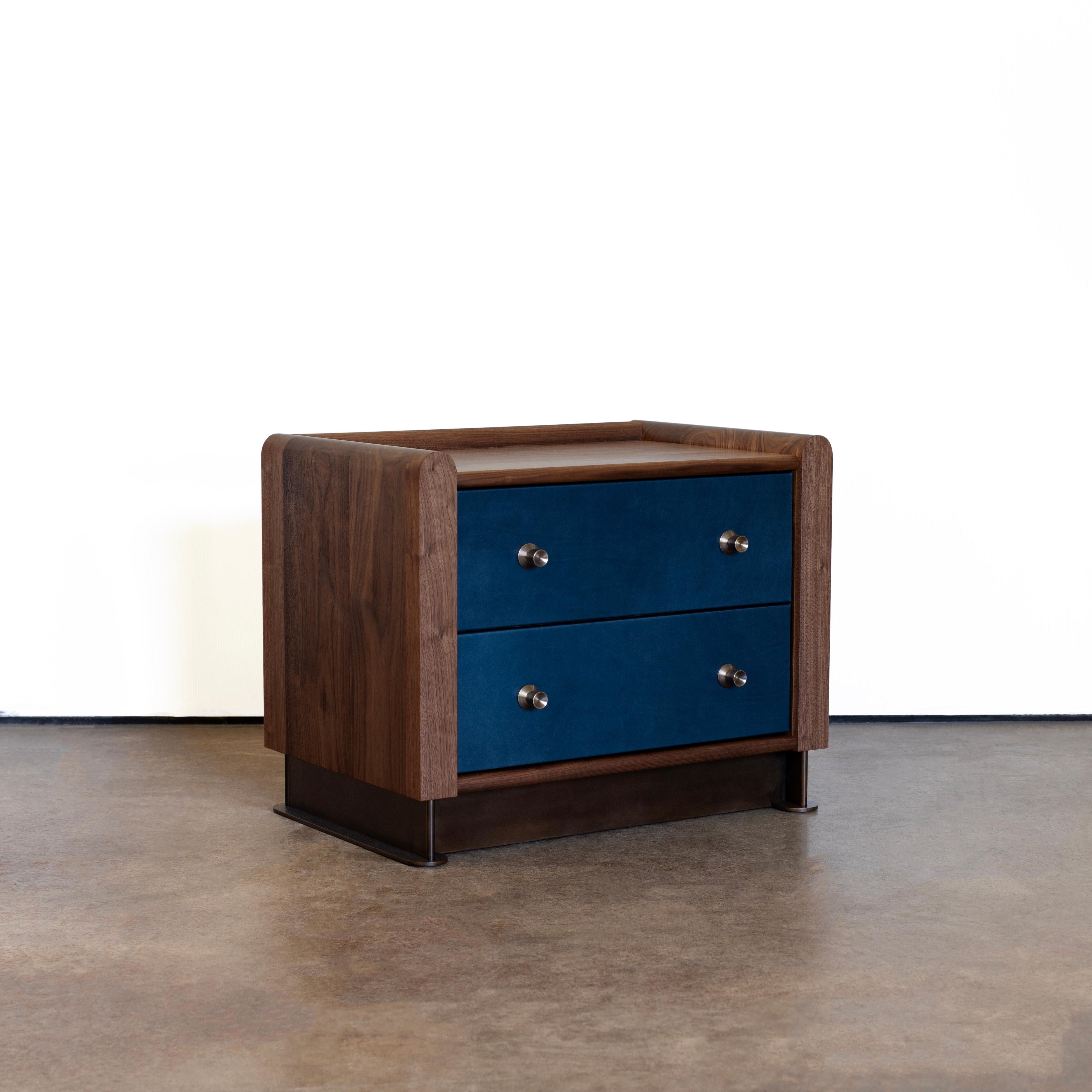 Alton Nightstand by Crump and Kwash 

Solid wood case / hand oiled finish / leather wrapped drawer fronts / premium, full extension, soft close drawer slides / solid maple, dovetailed drawer boxes / solid brass pulls / laser cut steel base

This