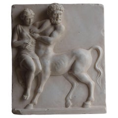 Altorrelieve -Violación del centauro Euritión por Hipodamia -mármol blanco de Carrara