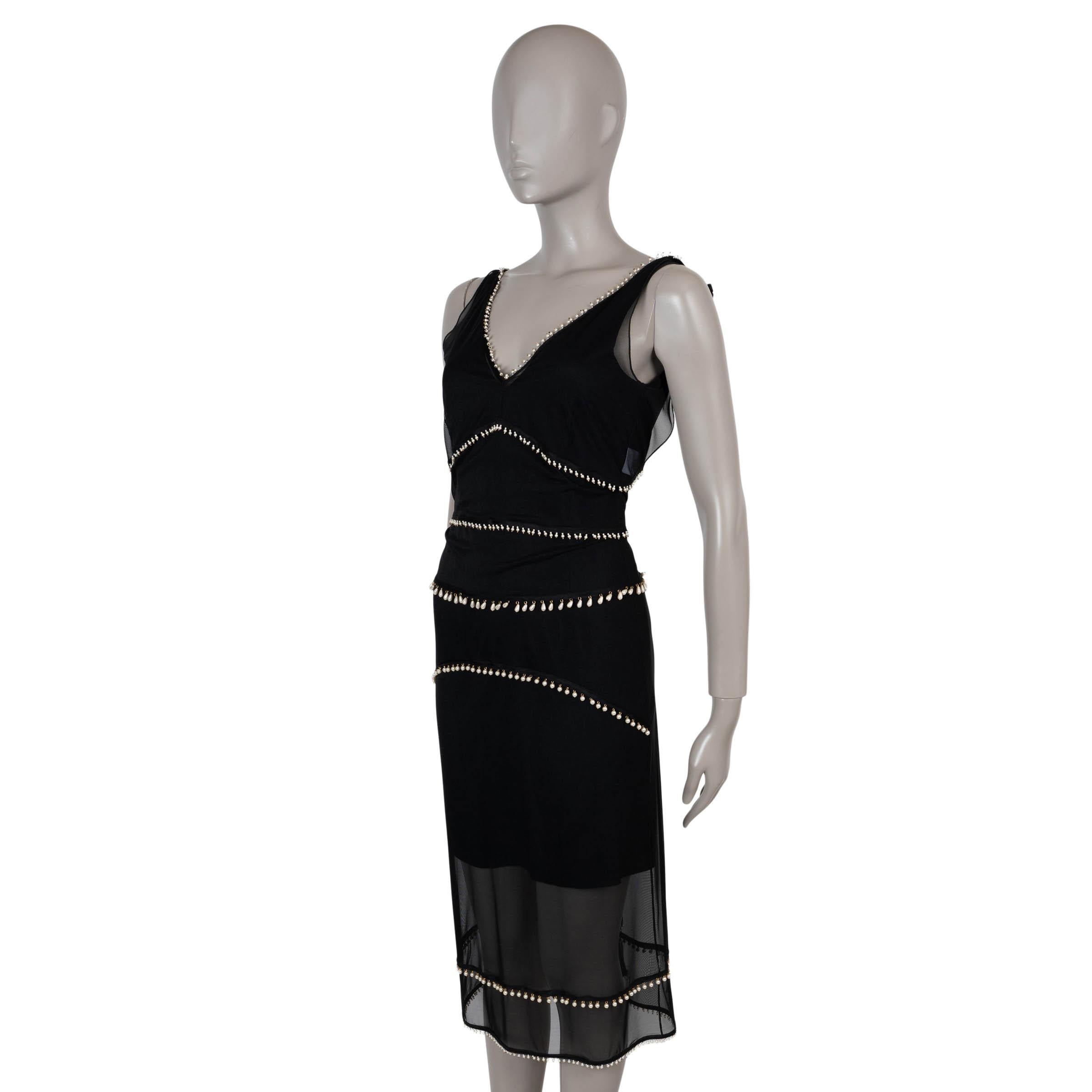 This 100% authentic Altuzarra Gabrieli cocktail dress in black mesh silk (100%) exudes modern allure. Designed with a sleeveless, fitted silhouette, it features a knee-length cut, deep V-neckline, and open back. Sheer throughout and delicately
