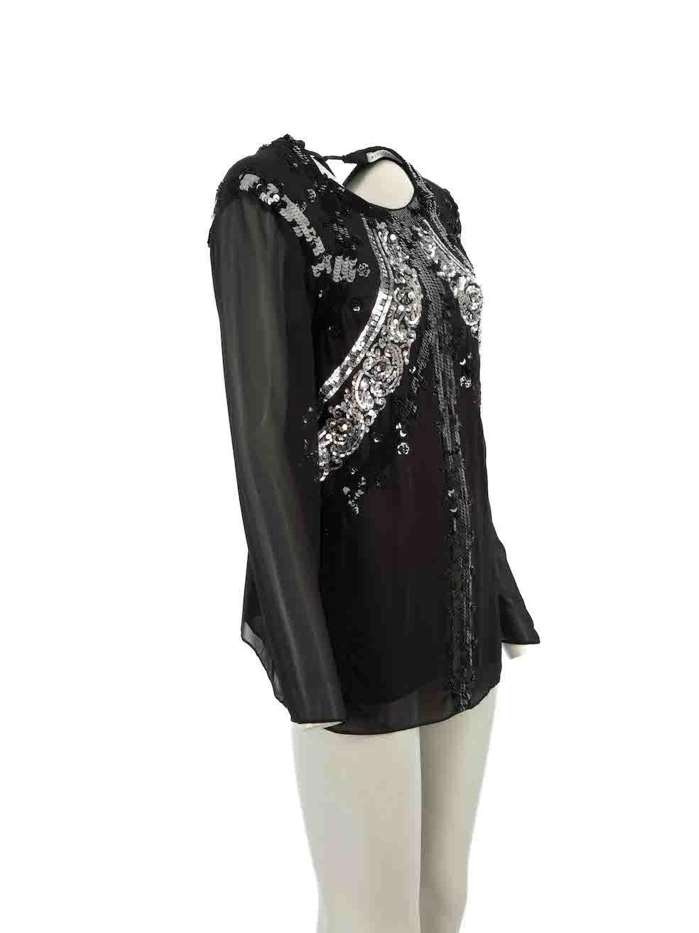 CONDITION is Good. Minor wear to top is evident. Light wear to embellishment with a handful of sequins missing at the right shoulder on this used Altuzarra resale item.
 
Details
Black
Silk
Long sleeves top
Sheer
Sequinned embellishment
Round