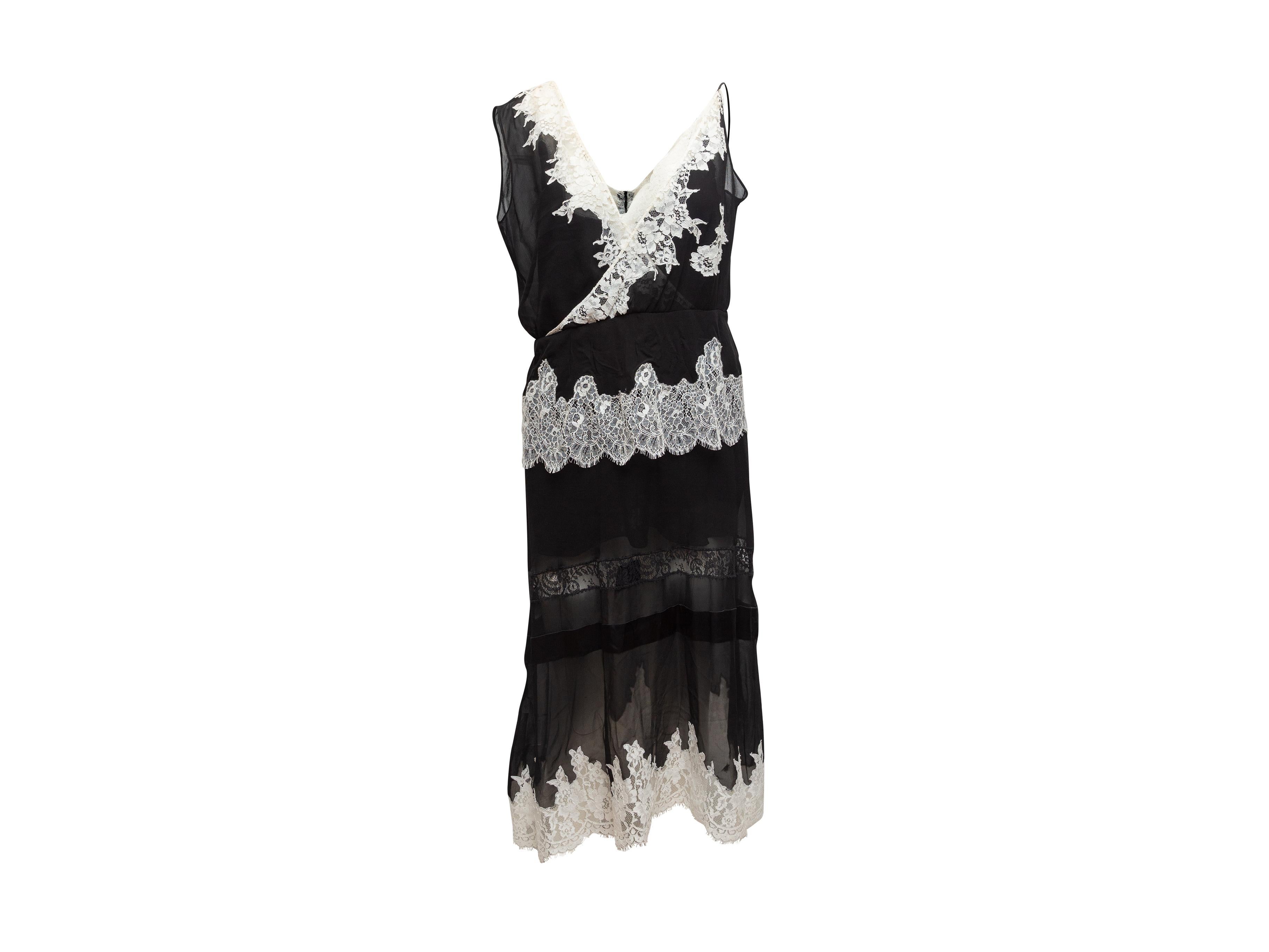 Product details: Black and white sleeveless silk dress by Altuzarra. Lace trim throughout. V-neck. Zip closure at back. Designer size 42. 36
