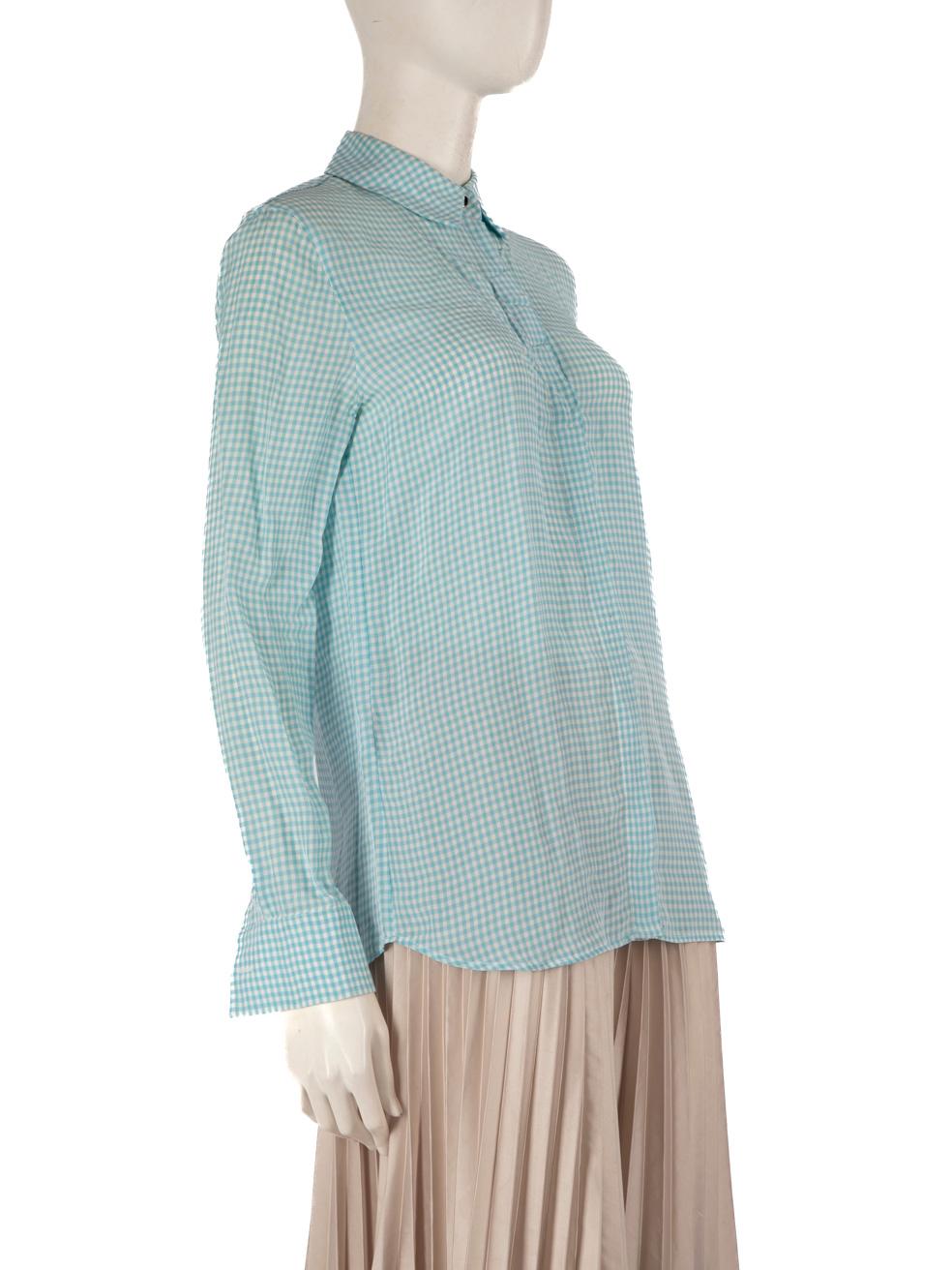 CONDITION is Good. General wear of the shirt is evident, there is discolouration on the internal collar, the inner and outer underarms and the yoke area. There are marks on both front panels near the button placket on this used Altuzarra designer