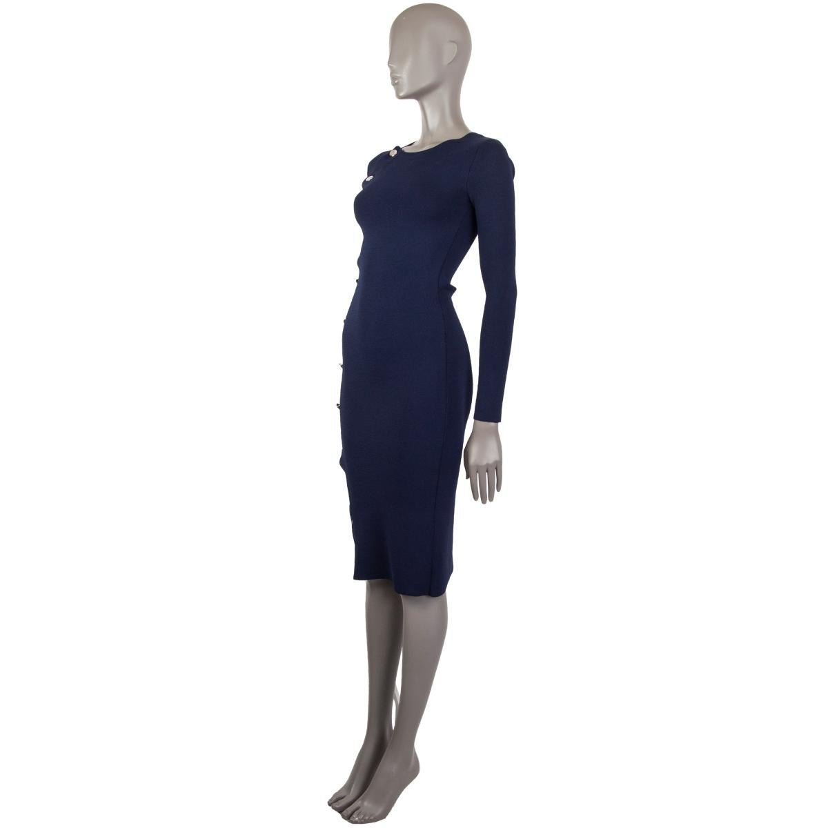 100% authentic Altuzarra side button dress in midnight blue viscose (63%) nylon (37%) with a close fitted silhouette, detailed with a row of high shine buttons, jewel neck, long sleeves to slip on. Unlined. Has been worn and is in