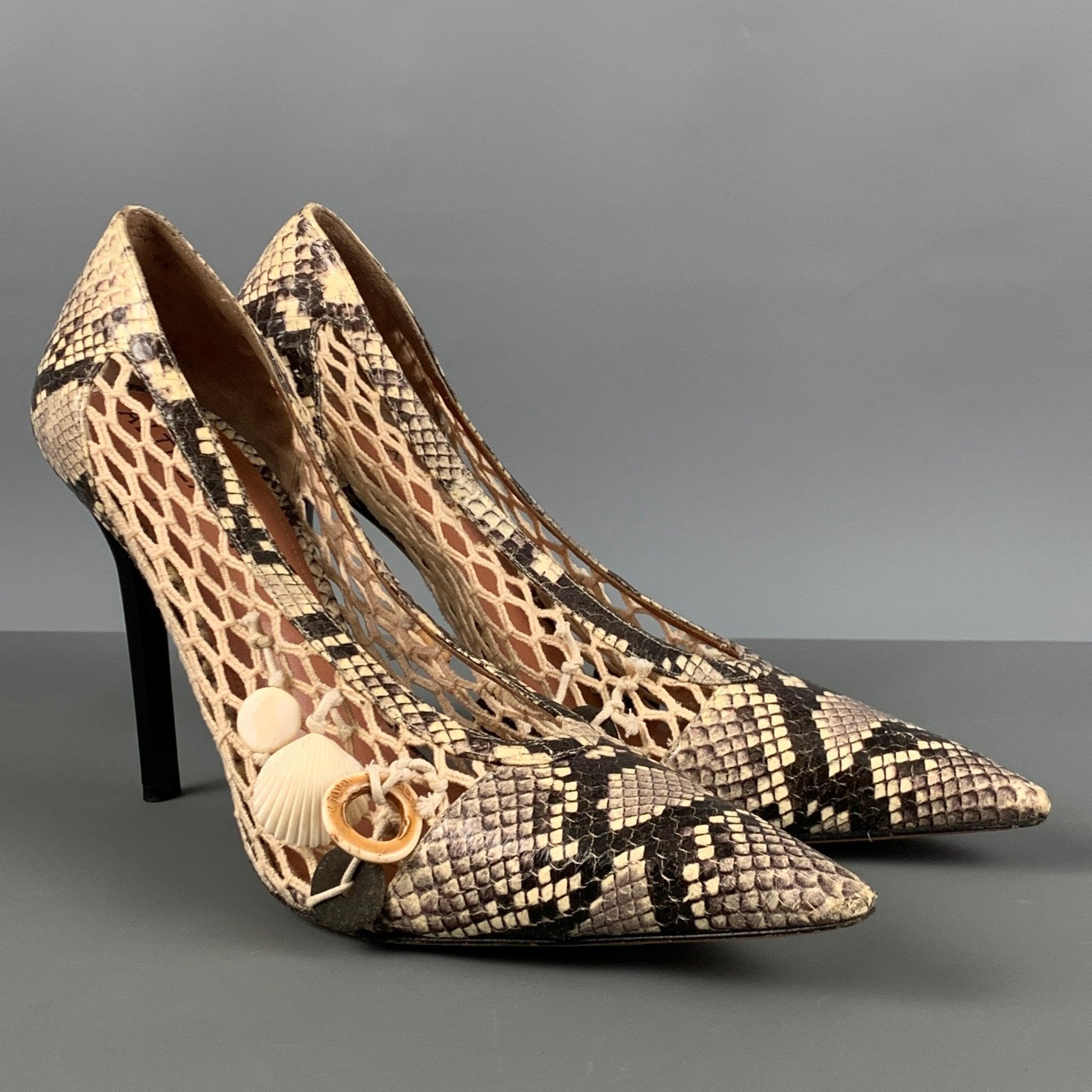 ALTUZARRA pumps comes in a beige and grey snake skin featuring a beige mesh detail, sea shells, pointed toe, and a stiletto heel. Made in Italy. Very Good Pre-Owned Condition. 

Marked:   41 

Measurements: 
  Heel: 4.5 inches   
  
  
 
Reference: