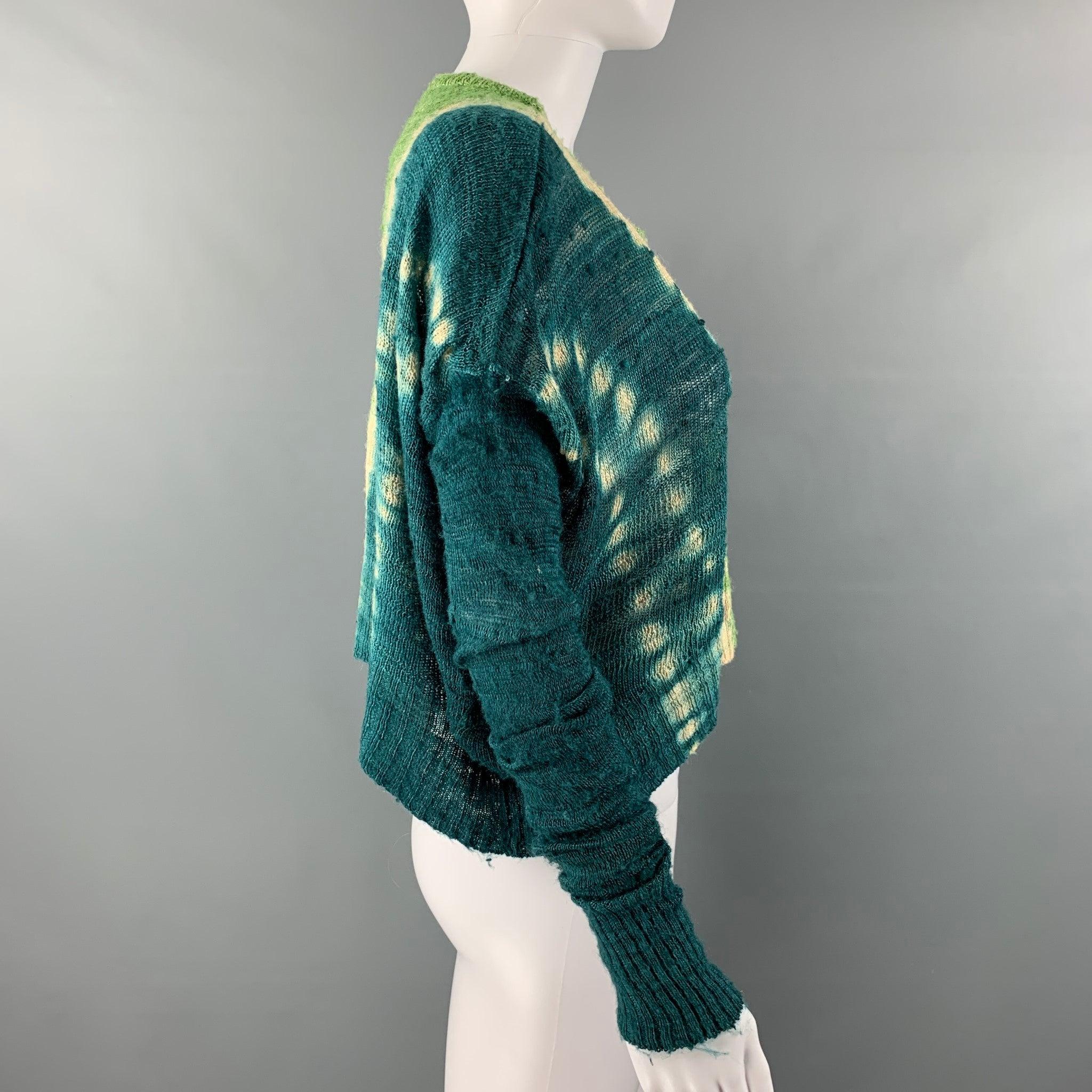 ALTUZARRA pullover comes in a green and blue silk tie dye knitted material featuring a dropped shoulder, cropped style and a crew-neck.Good Pre-Owned Condition. As Is. 

Marked:   S 

Measurements: 
 
Shoulder: 18 inches  Bust: 60 inches  Sleeve: 24