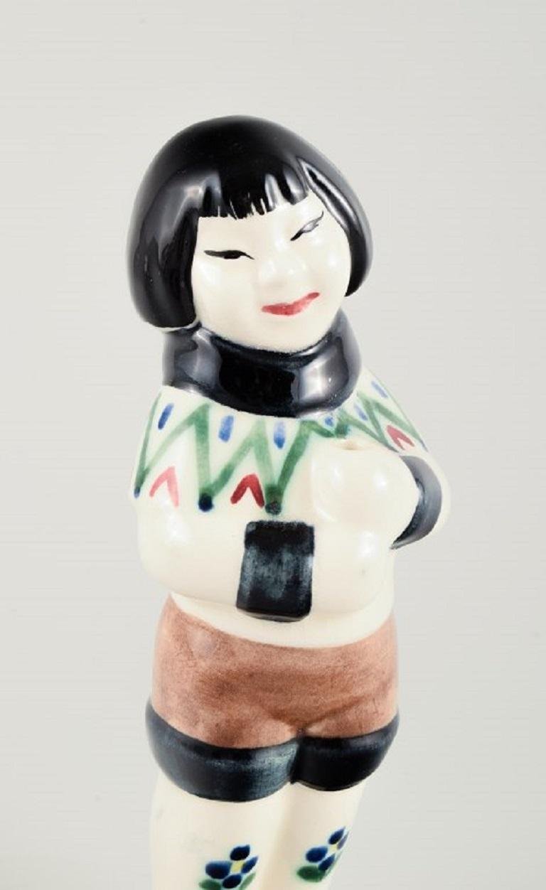 Danish Aluminia Children's Aid Day figurine of a Greenlandic girl. Dated 1959. For Sale