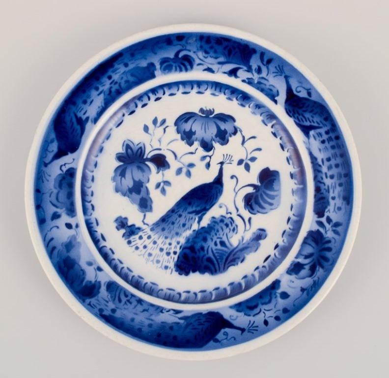 Danish Aluminia, Denmark. Oval dish and two plates in faience. Peacock pattern. For Sale