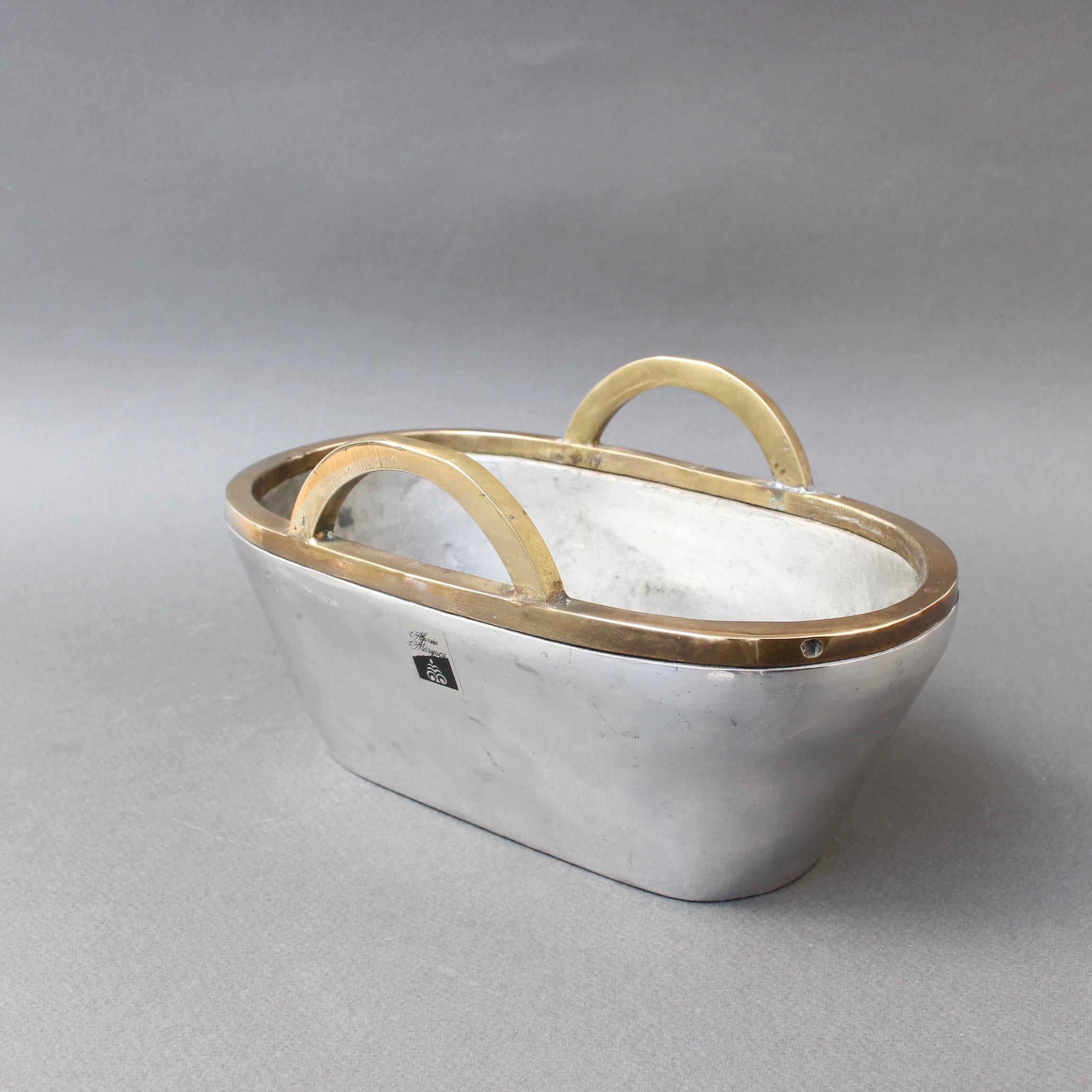 Aluminium and brass Brutalist style vide-poche by Alfonso Marquez (in the style of David Marshall). Weighty and wonderfully tactile, this bowl is decoratively in the shape of a basket but entirely in brass and aluminium. Imagine the piece in your