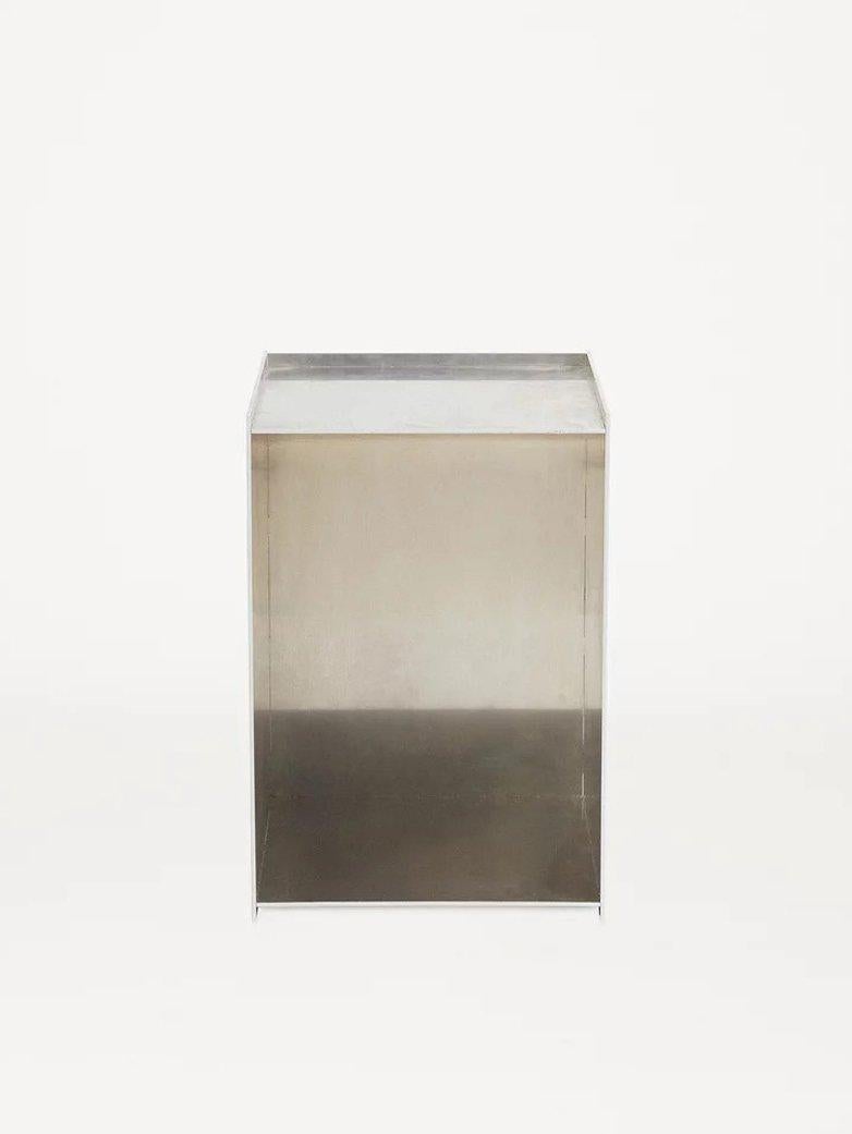 This beautifully crafted piece is made of untreated aluminum and is reminiscent of Donald Judd's design style.