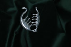 Aluminium cast abstract hair clip sculpture by Olga Flór