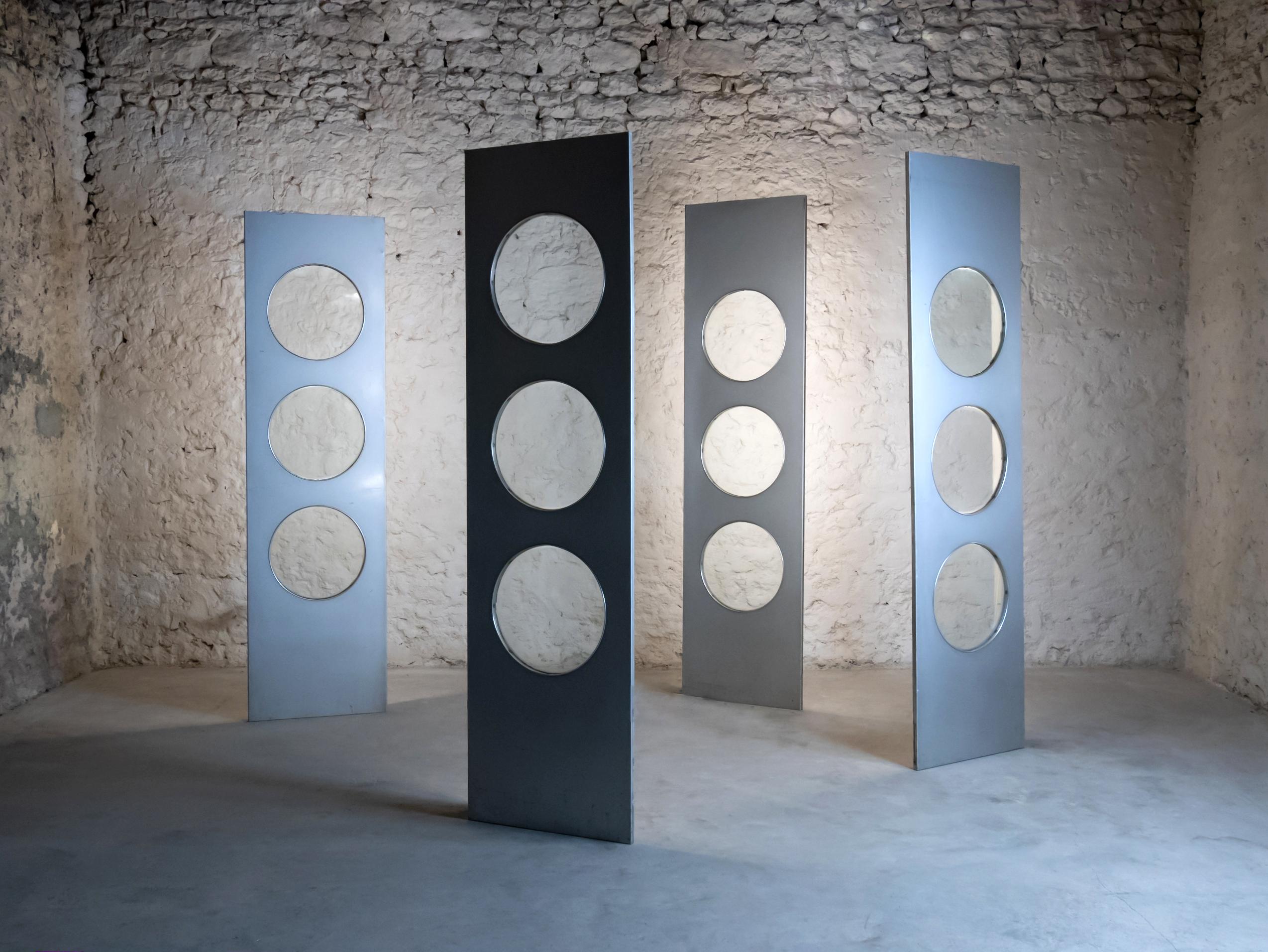 4 original facade elements from Paris, France, circa 1960 in the style of Jean Prouvé (the covered the front of a musicstore once)

Wood covered with aluminium sheets, with each 3 portholes - these 4 elements are back-illuminated!
Easy to handle