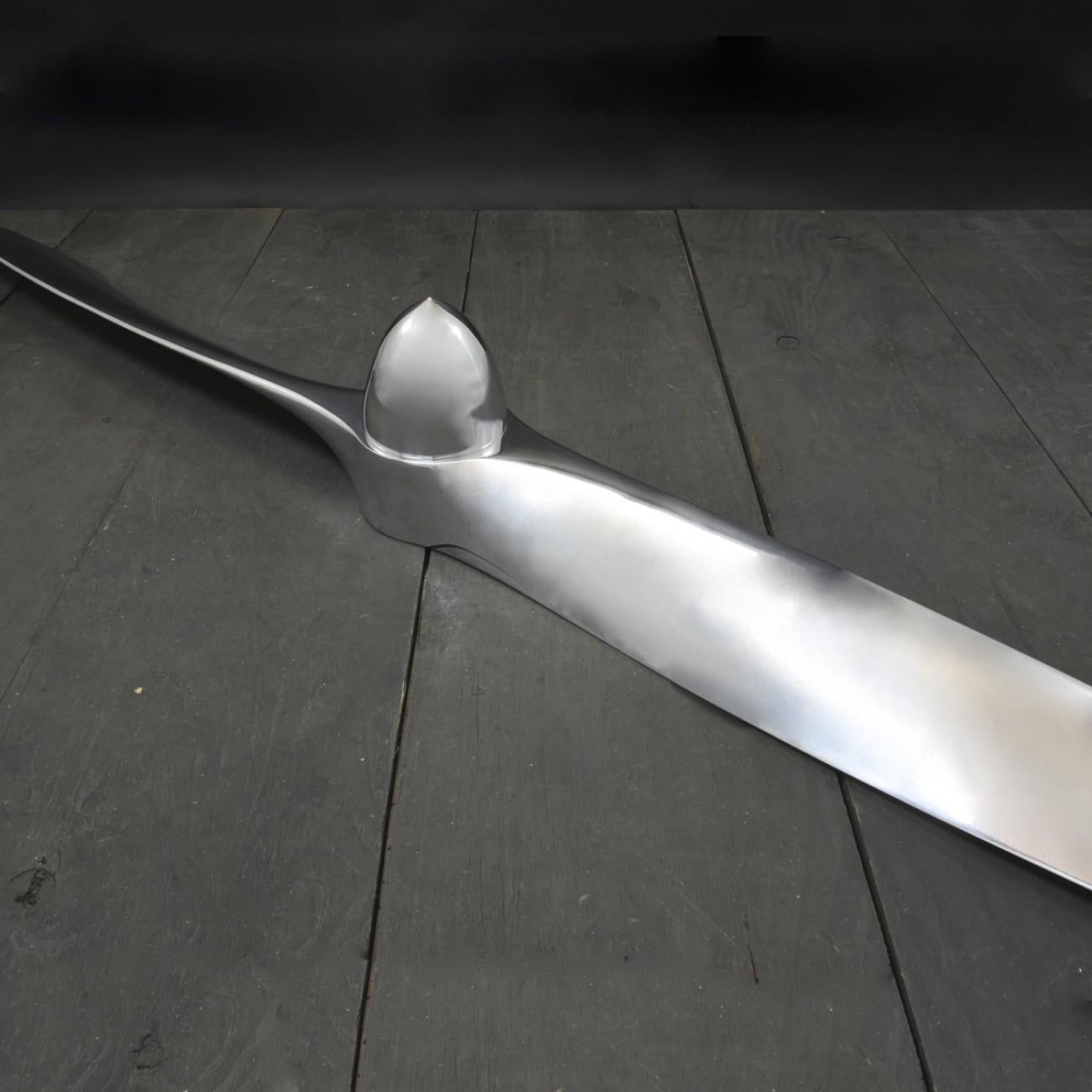 Polished cast aluminium propeller, circa 1965. Fitted with decorative polished cast aluminium conical central spinner. The propeller comes with a bracket that is fixed to the wall and the propeller is then lifted on to the bracket.

Dimensions: 194