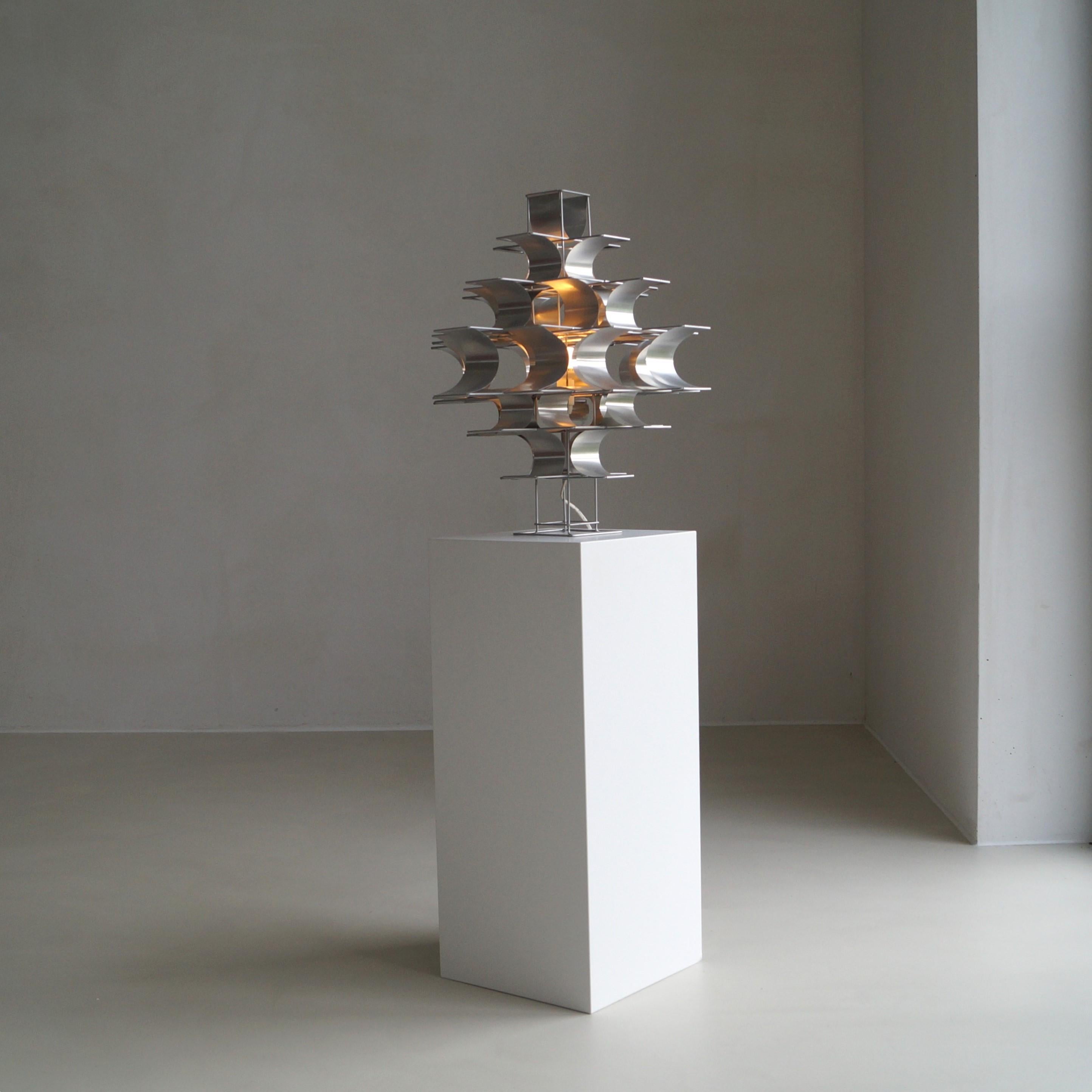 An iconic Max Sauze ''Cassiopeia'' table lamp/also suitable as pendant. Very decorative geometrical design, very pleasing to the eye. It's a lamp as well as a sculpture. It has many different forms and shapes depending on the angle it's viewed