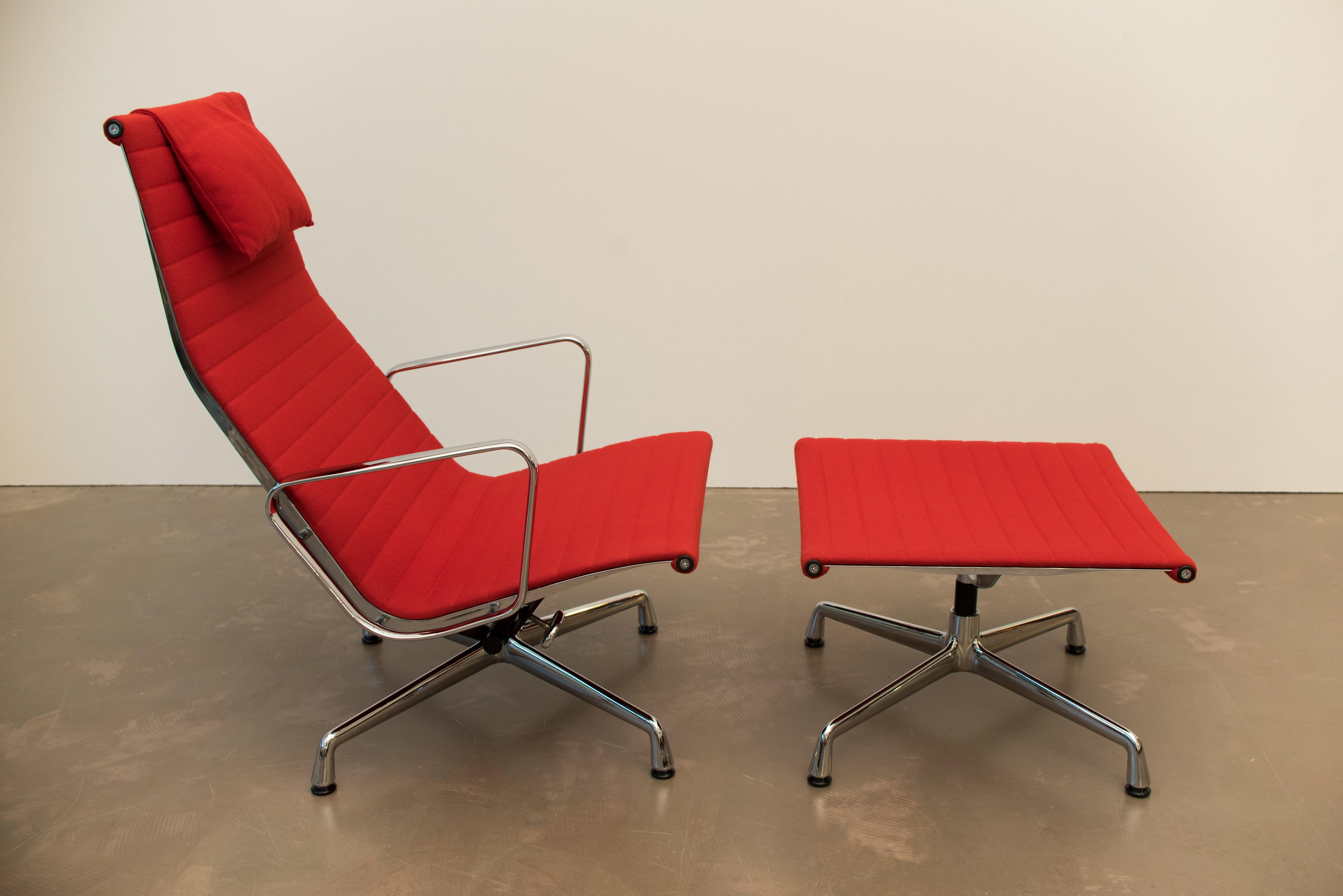 Vintage EA 124 aluminium swivel chair with ottoman was designed by Charles and Ray Eames and was produced by Vitra in the 1960s.