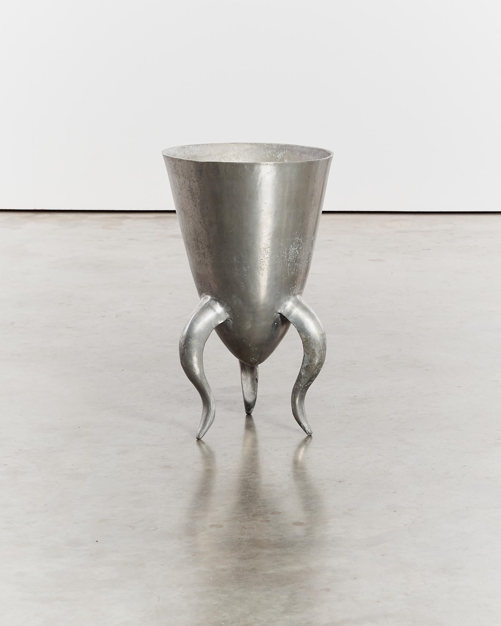 Sculptural aluminium vessel/planter, with undulating curved tripod legs. Sourced from the Netherlands. 
Material: Aluminium

Period: Circa 1970's

Dimensions: H52 x D30cm

Condition: Good vintage condition, surface wear in keeping with age