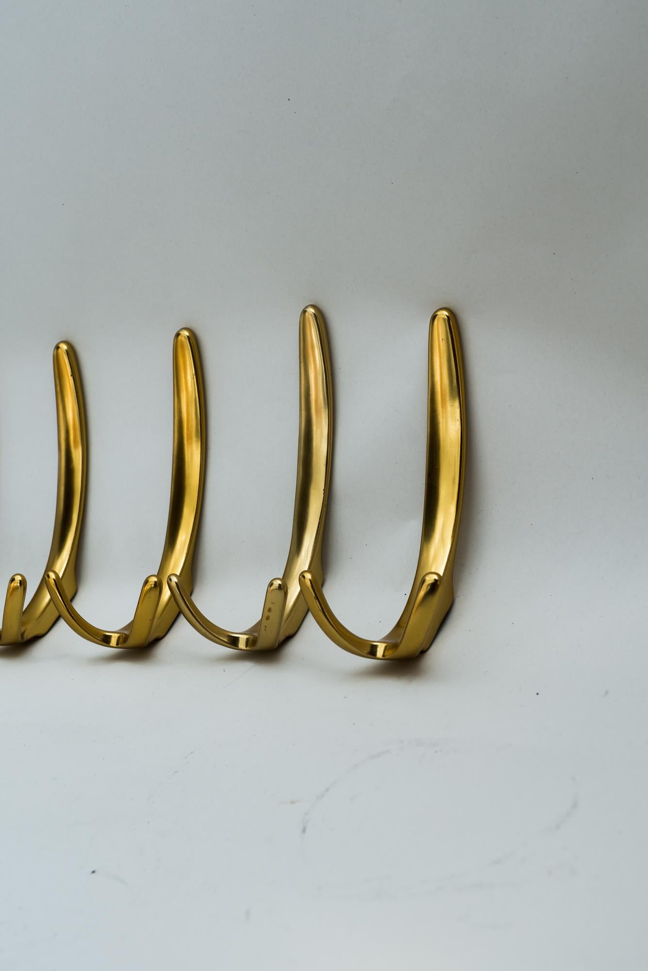 Aluminum wall hooks, Vienna, circa 1960s
It is not possible to attach on wall directly.
It can only be mounted on a wooden plate or metal plate and then attach the entire construction to the wall.
Good original condition.