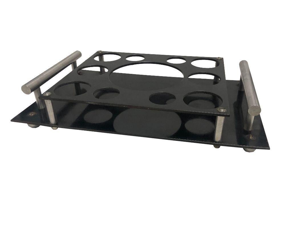 The Aluminum and Bakelite Drink Holder Tray by Aero-Art Los Angeles blends vintage aesthetics with modern functionality. Crafted with durable aluminum and sleek Bakelite accents, it exudes elegance while ensuring stability for your beverages.