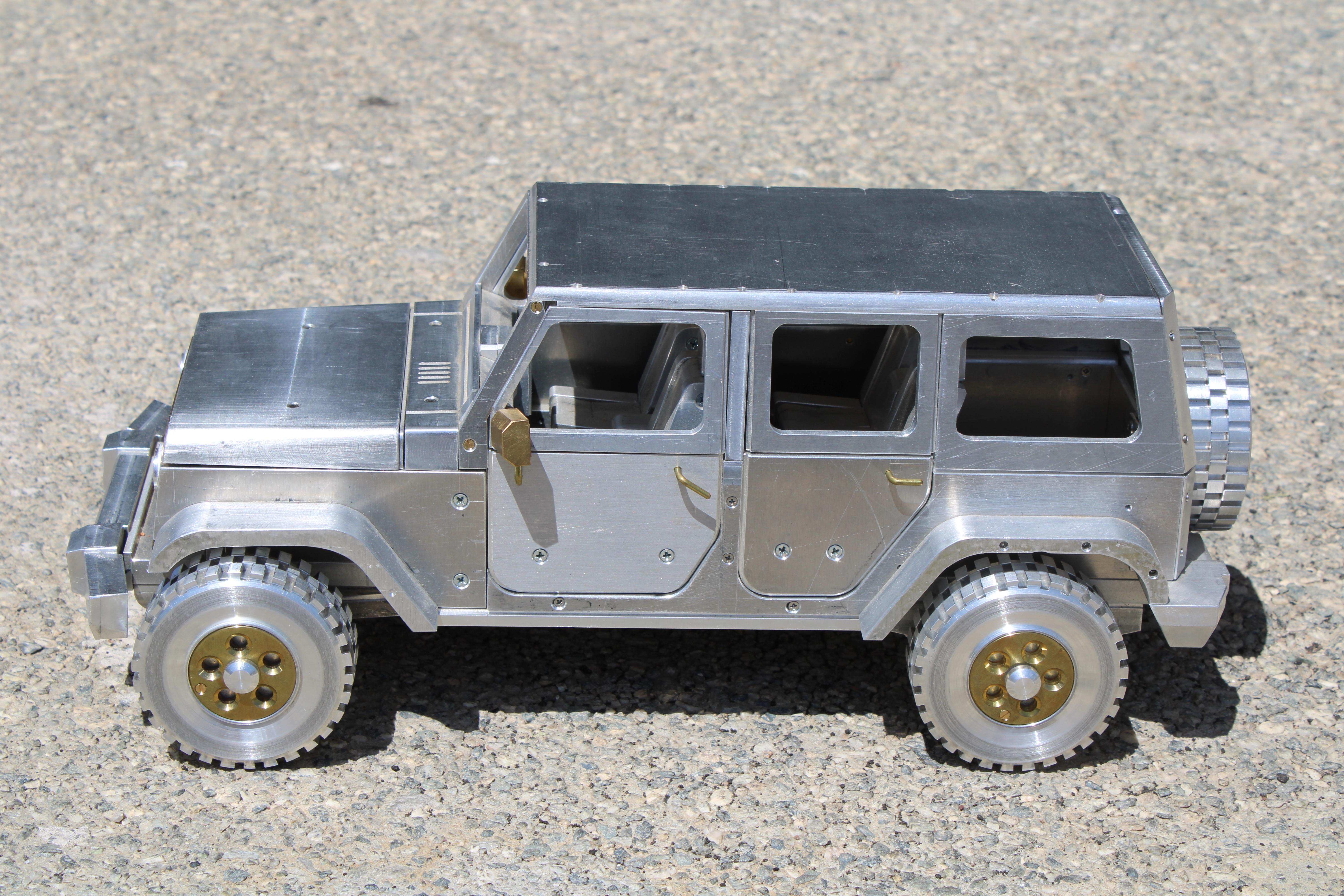 Studio aluminum and brass Jeep. Looks like a salesman sample in a car dealership. We were told an engineer that worked at Alamogordo, NM made this Jeep and another one which is listed separately. The 4 wheels come off for portability. Jeep measures