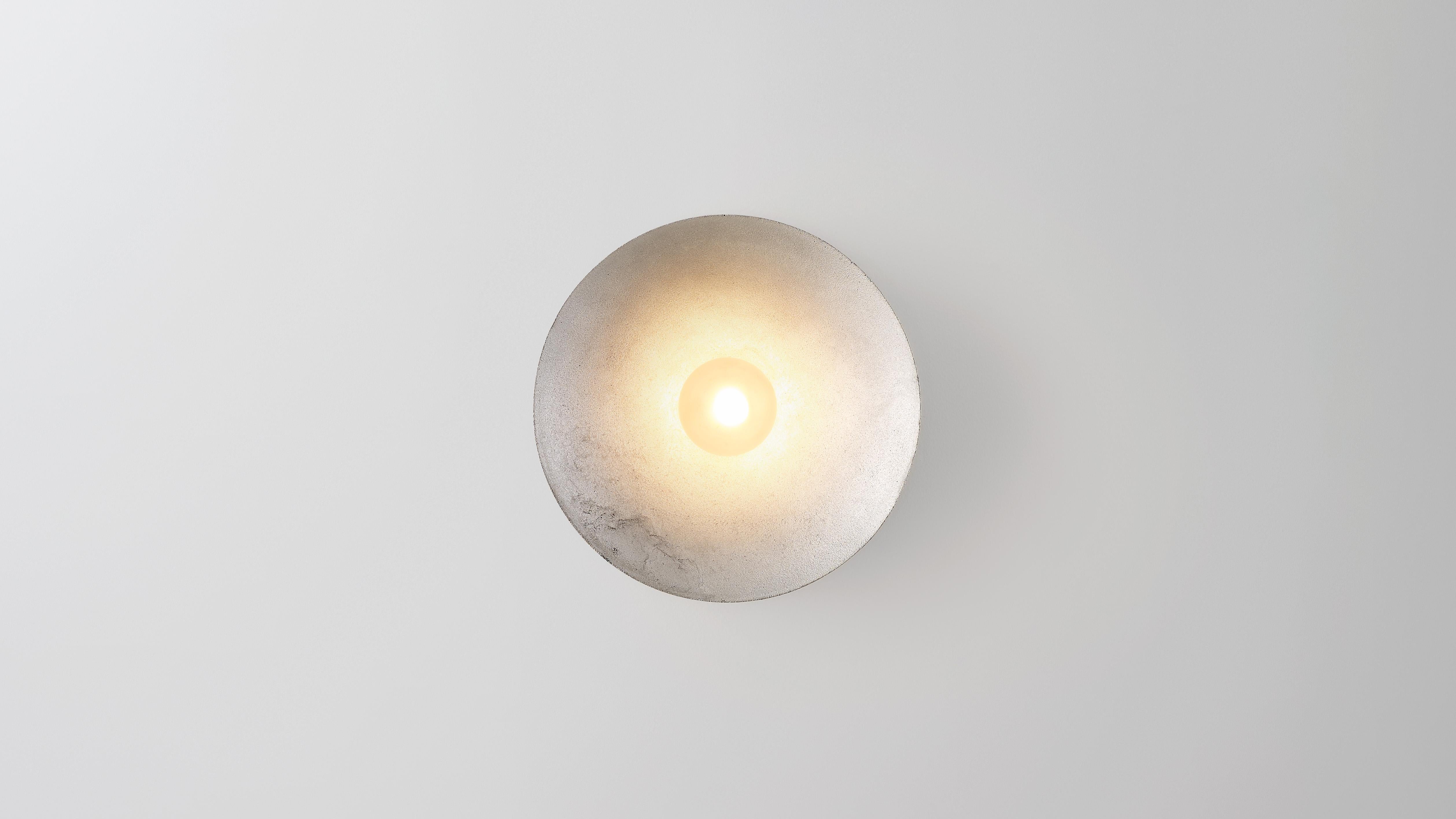 Aluminum Anton wall scounce by Volker Haug
Dimensions: Diameter 18 cm x Depth 10.3 cm 
Material: Cast Aluminum.
Finish: Raw
Lamp: G9 LED (240V / 120V US). 12V option is available.
Glass Bulb: 45mm ø, Frosted
Weight: 1.5kg