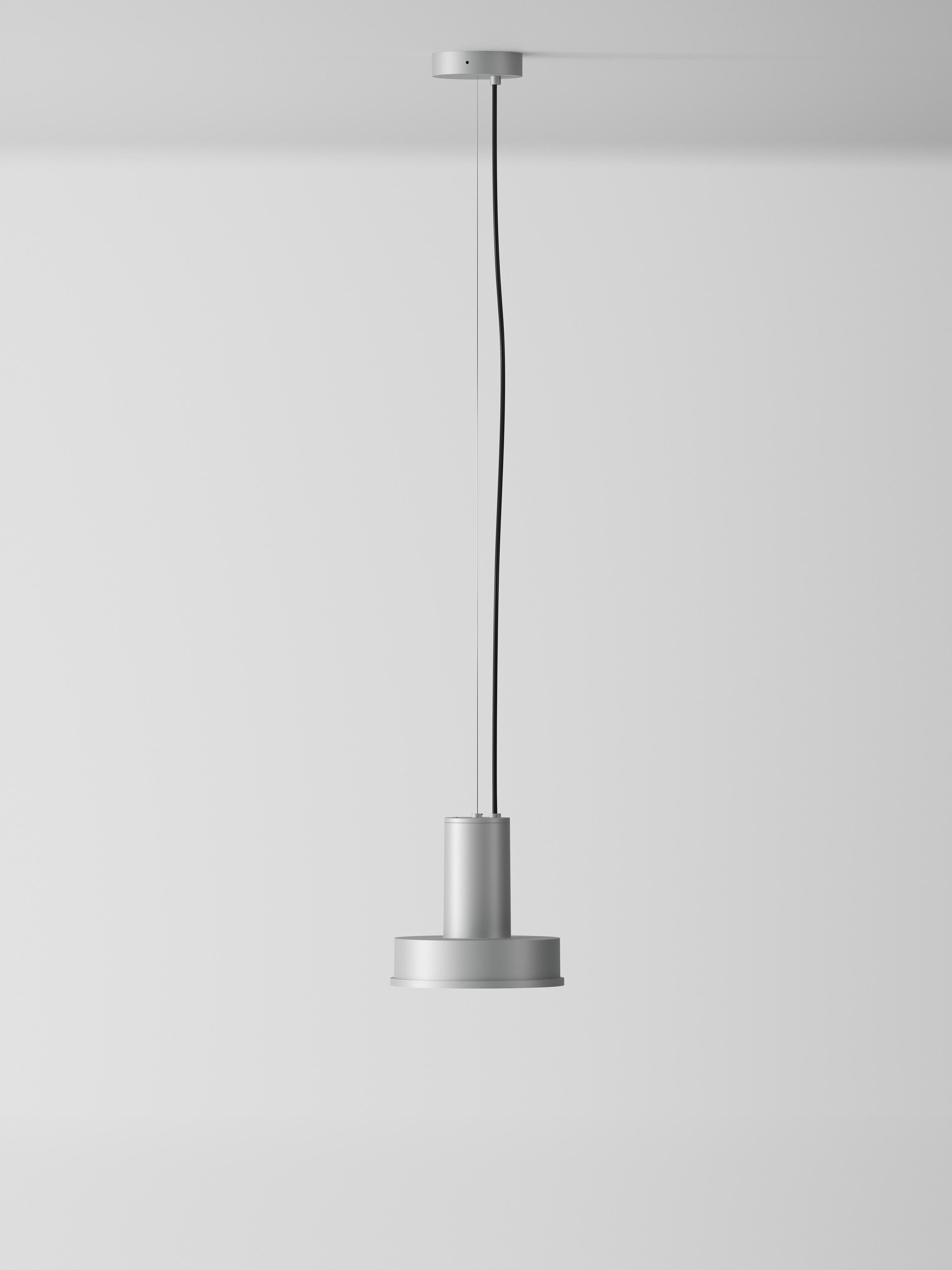 Aluminum Arne S Domus pendant lamp by Santa & Cole
Dimensions: D 23 x H 440 cm.
Materials: metal, aluminum.
Available in other colors.

Its aluminium body houses the very best LED technology with a single COB emitter, shielded from view by a