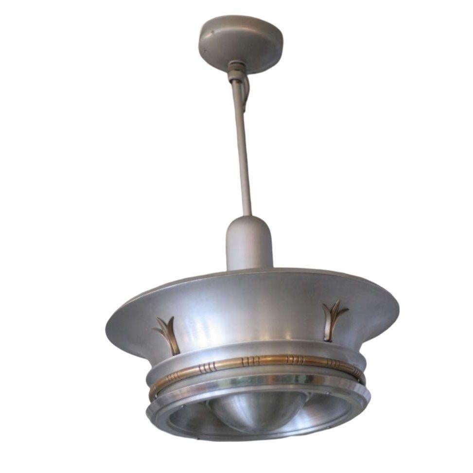 Aluminum ceiling pendant with elegant neoclassical brass accents.
Two available.
  