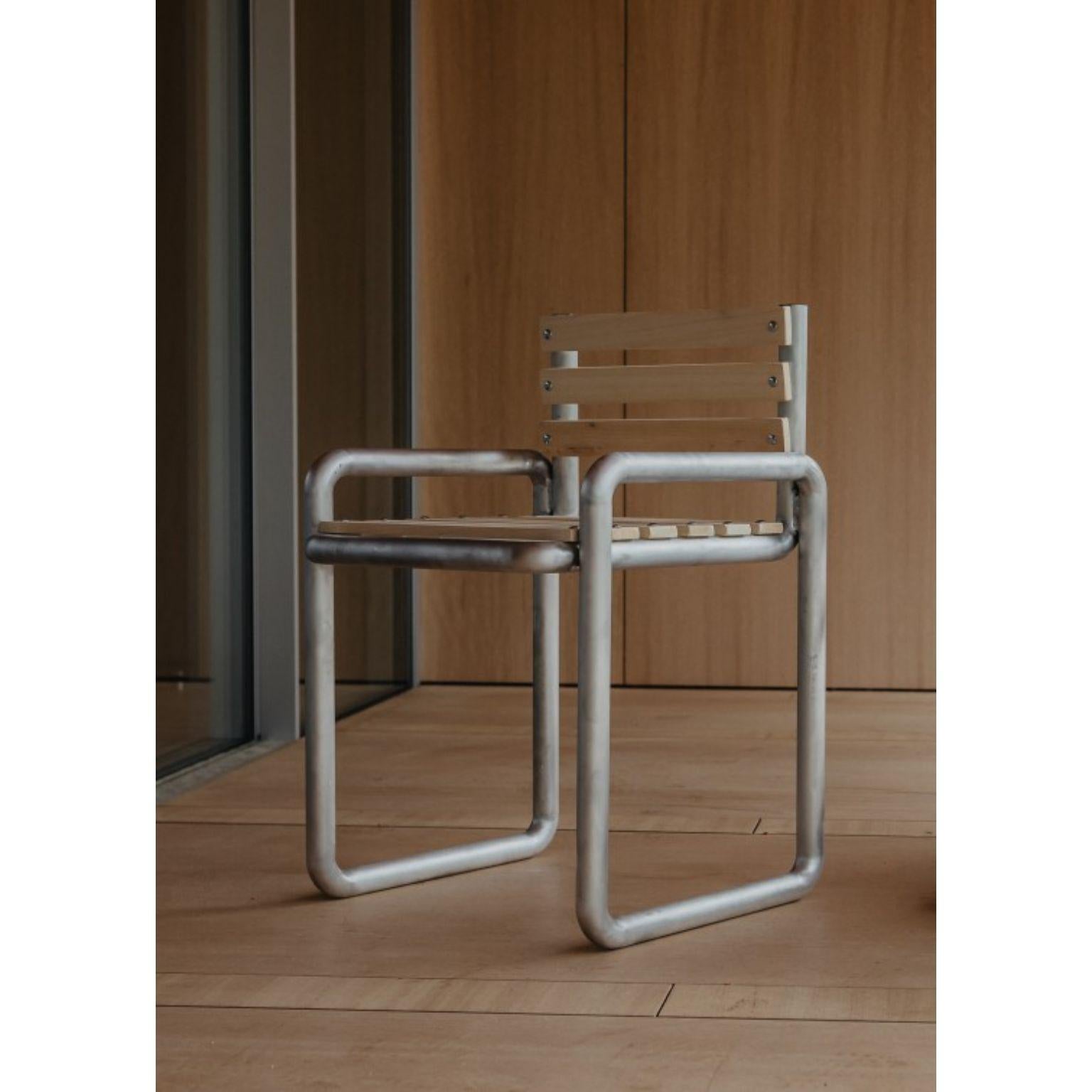 Aluminum Chair by Mylene Niedzialkowski
Dimensions: D 43 x H 83. SH 41 cm.
Materials: Aluminum and wood.

Basic shapes associated with masculine airs, Chair is all aluminum tubes and light local wood.  For an outside use as inside, it can be
