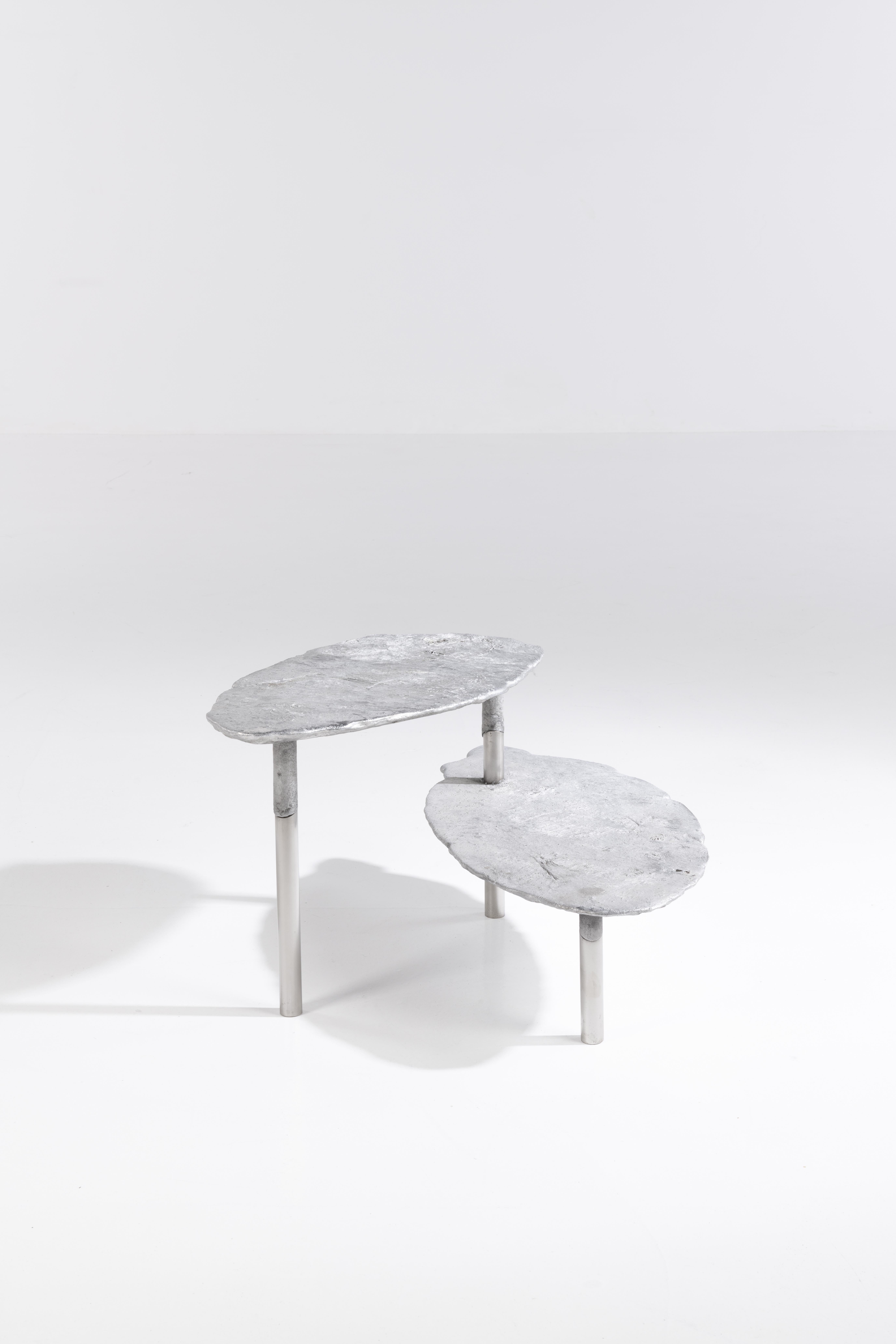 Aluminum concretion coffee table by Studio Julien Manaira
Dimensions: 65 x 65 x 40 cm
Materials: Aluminium and stainless steel

The concretion project consists of sand-casting aluminium in a base of stainless steel tubes to form objects. The