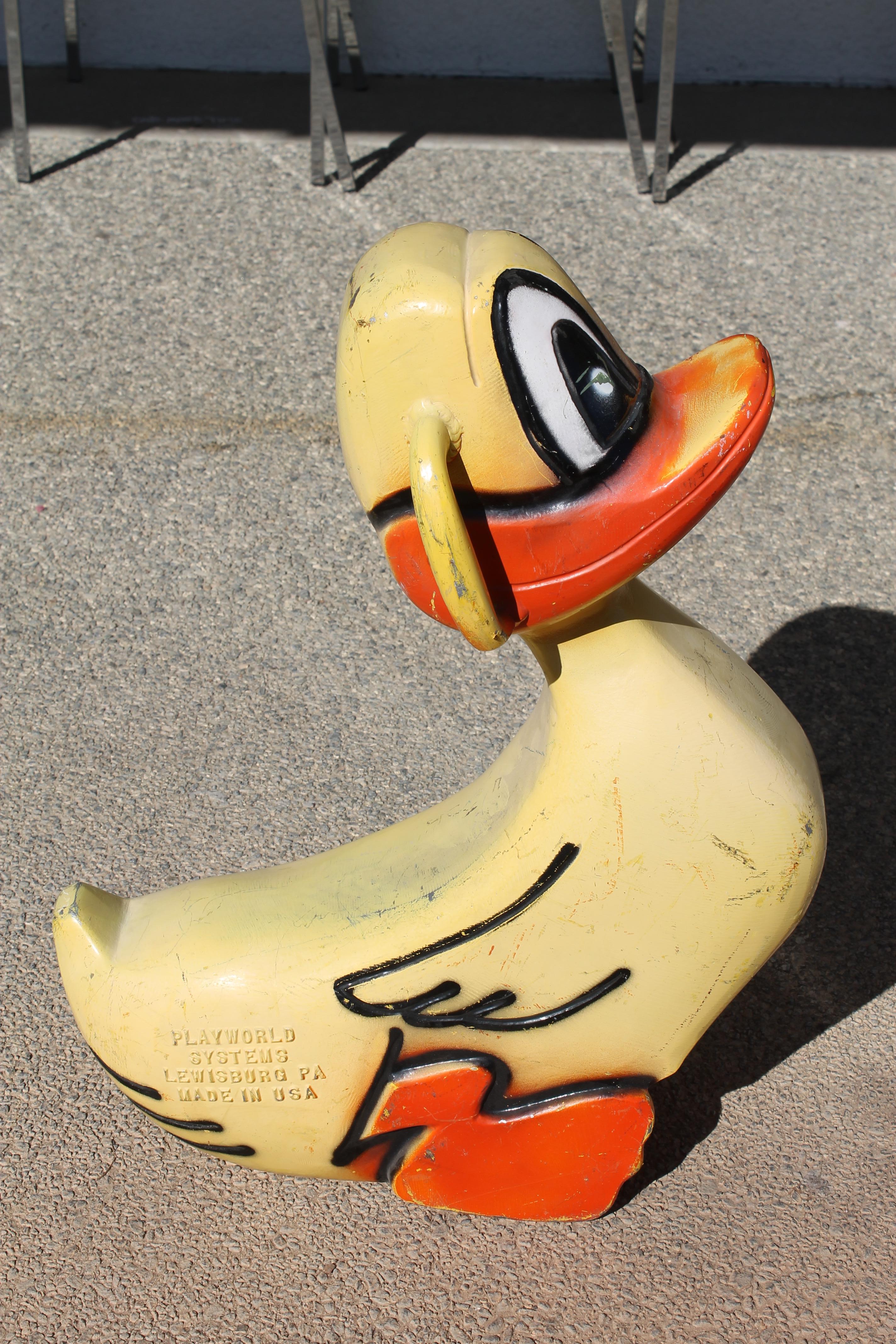 This aluminum duck sculpture was originally a playground spring ride located throughout parks. Spring is not included. It's more sculptural and part of Americana history. This duck has the original paint and is one of the best ones we have in stock.