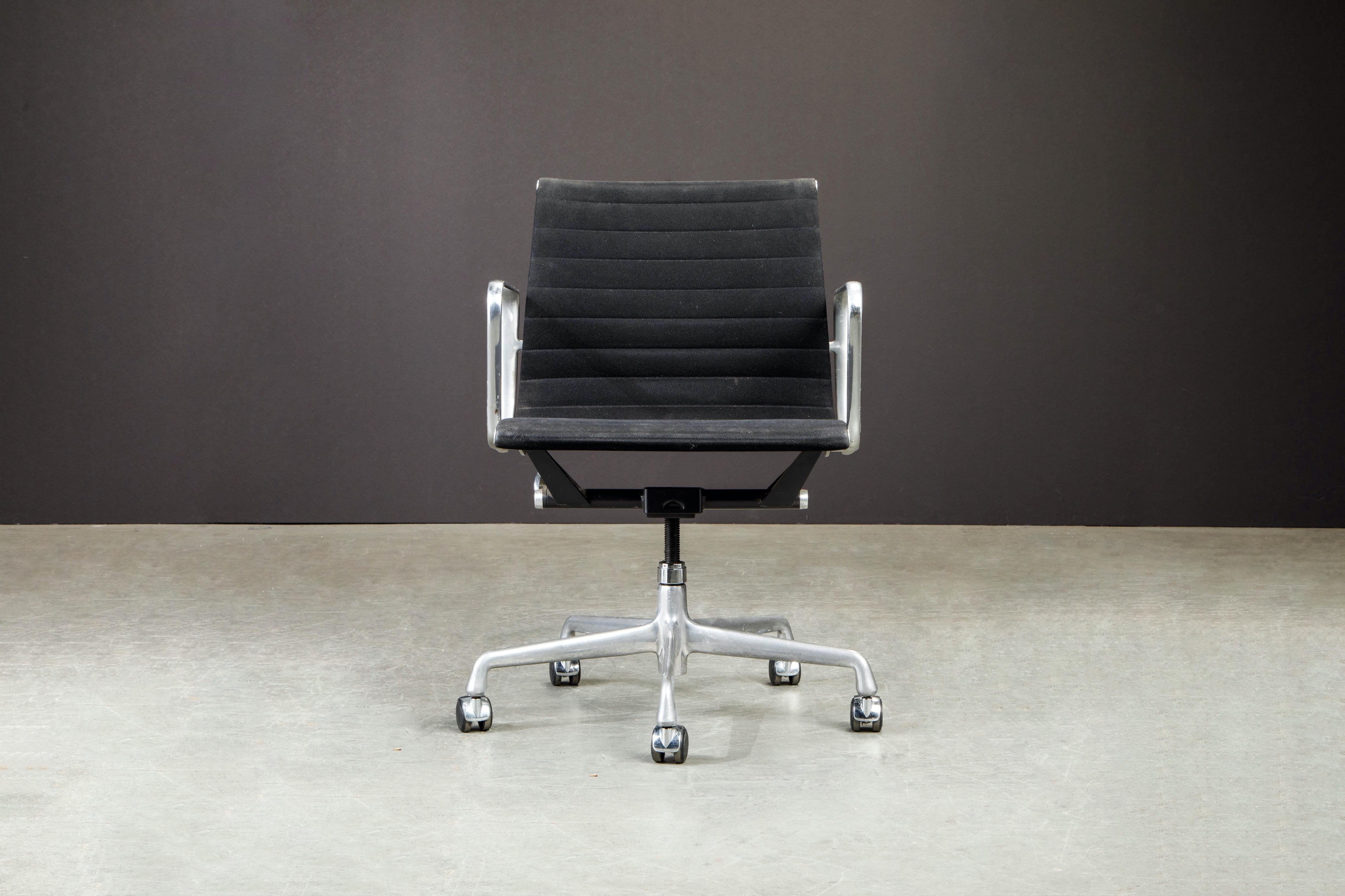 This classic and stylish 'Aluminum Group' executive desk chair by Charles and Ray Eames for Herman Miller. Signed underneath seat with Herman Miller labels and production date September 2000. 

This beautiful office chair features black channel