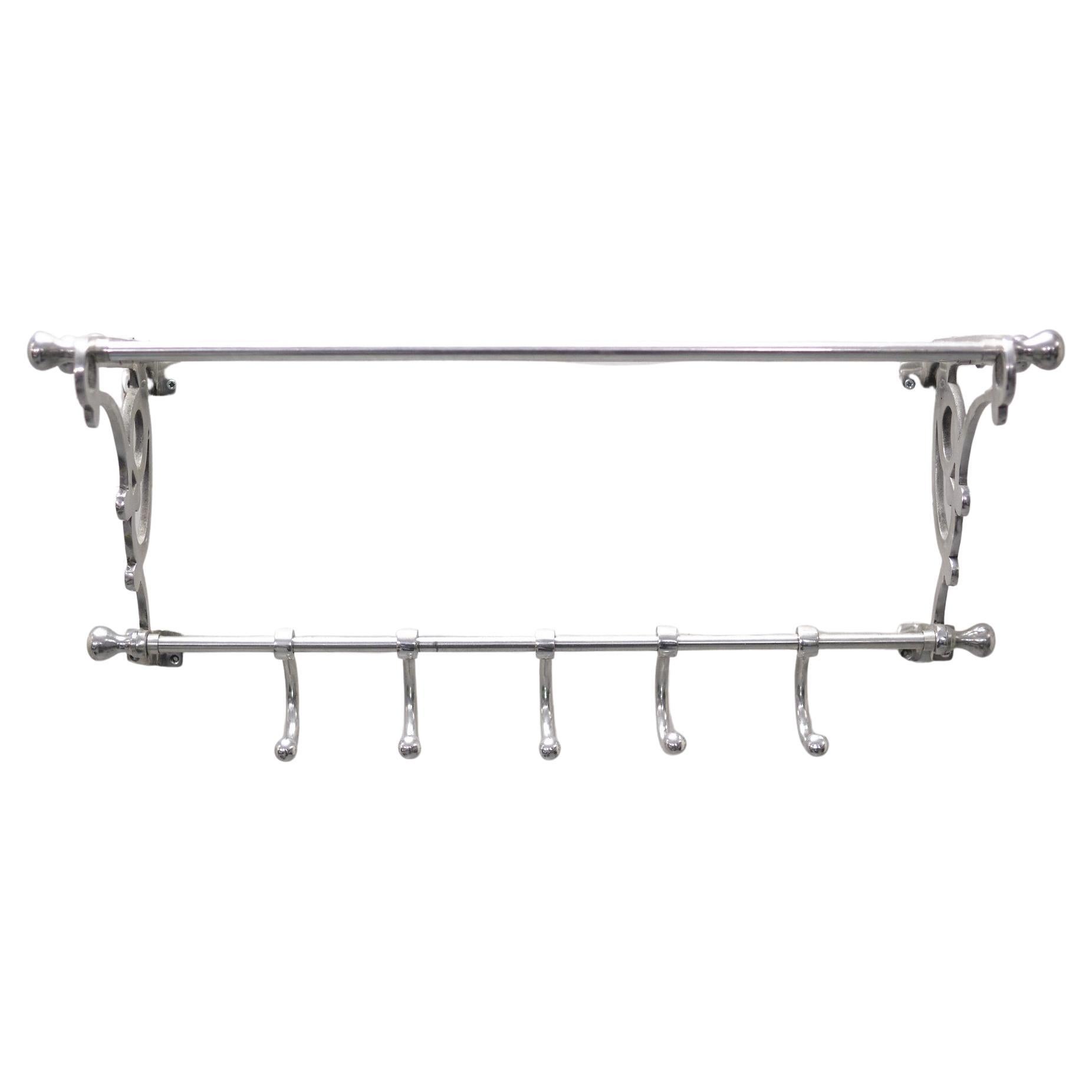 Very nice polished Aluminum hanging Coatrack. Art Deco style. 5 Large hooks 
comes with a rack on top for your Had or Cap.