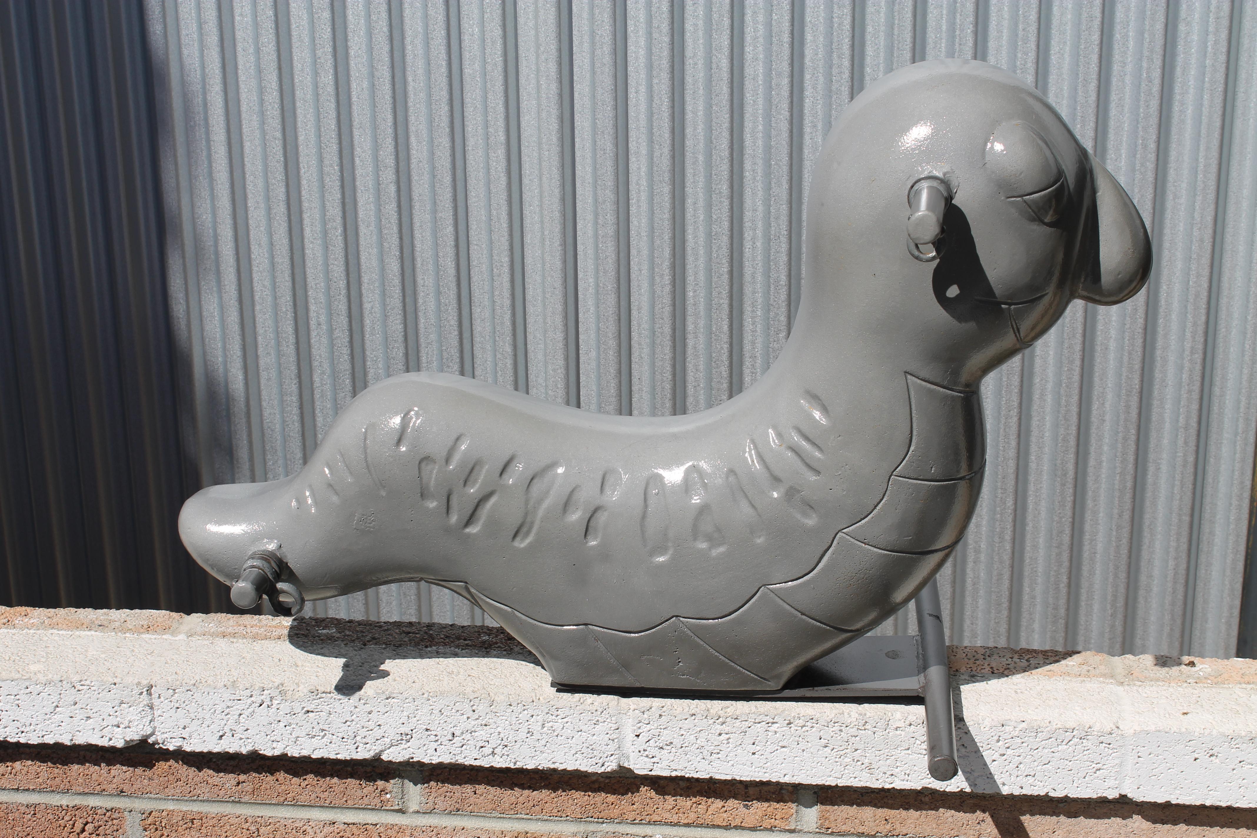 This aluminum inchworm sculpture was originally a playground spring ride located throughout parks. Spring is not included. It's more sculptural and part of Americana history. We had it sand blasted and clear coated. Inchworm measures 31