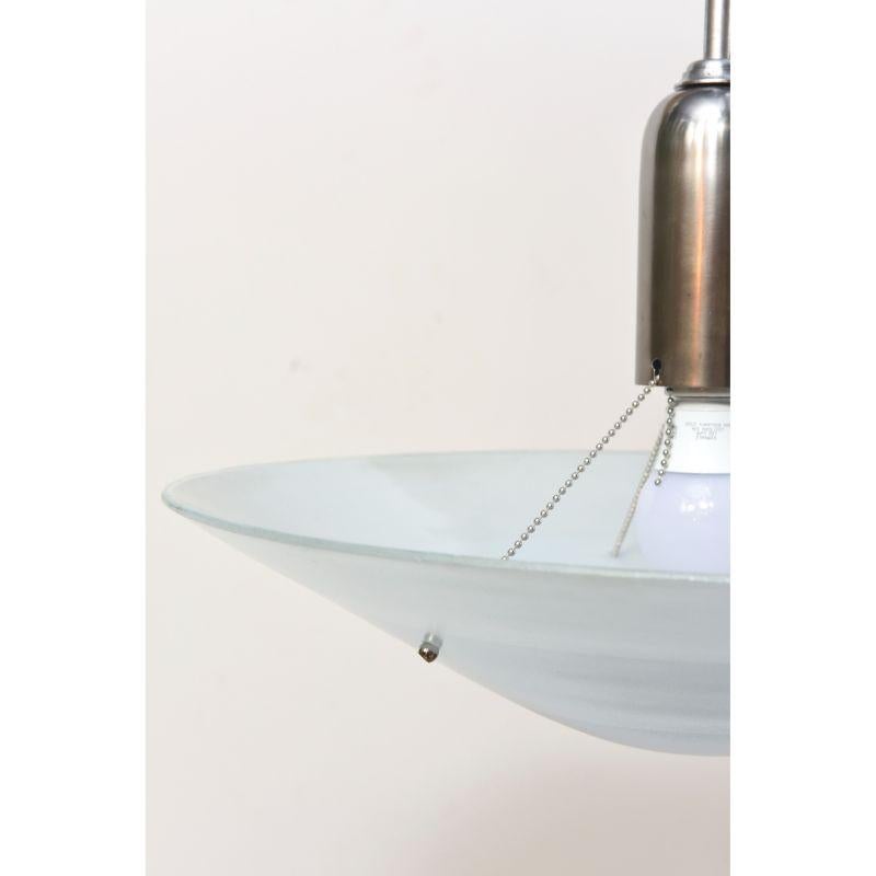 Blue glass disk pendant suspended from an aluminum tube light. The tube is mounted on a swivel for straight hanging.  the glass is a textured tempered glass with three graduated tones of blue. Completely Restored and rewired, ready to install.