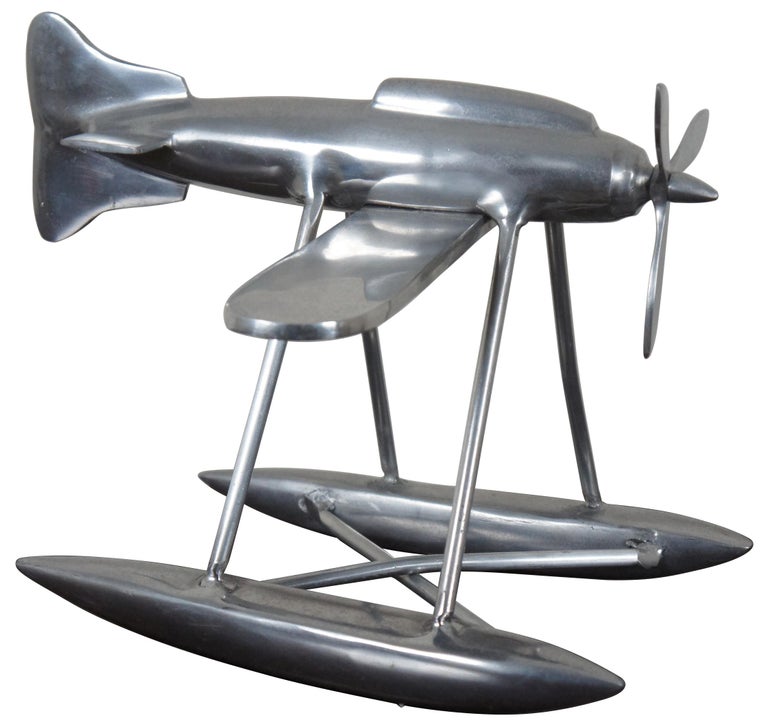 Vintage aluminum model propeller sea plane with pontoons for water landing. Measures: 18