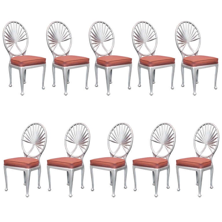 Midcentury palm leaf dining room chairs featuring a decorative palm leaf along the back and fabric upholstery seat. Made In Southern California by The Tropitone company as part of their Veneman collection.
These chairs have been in a rust resistant