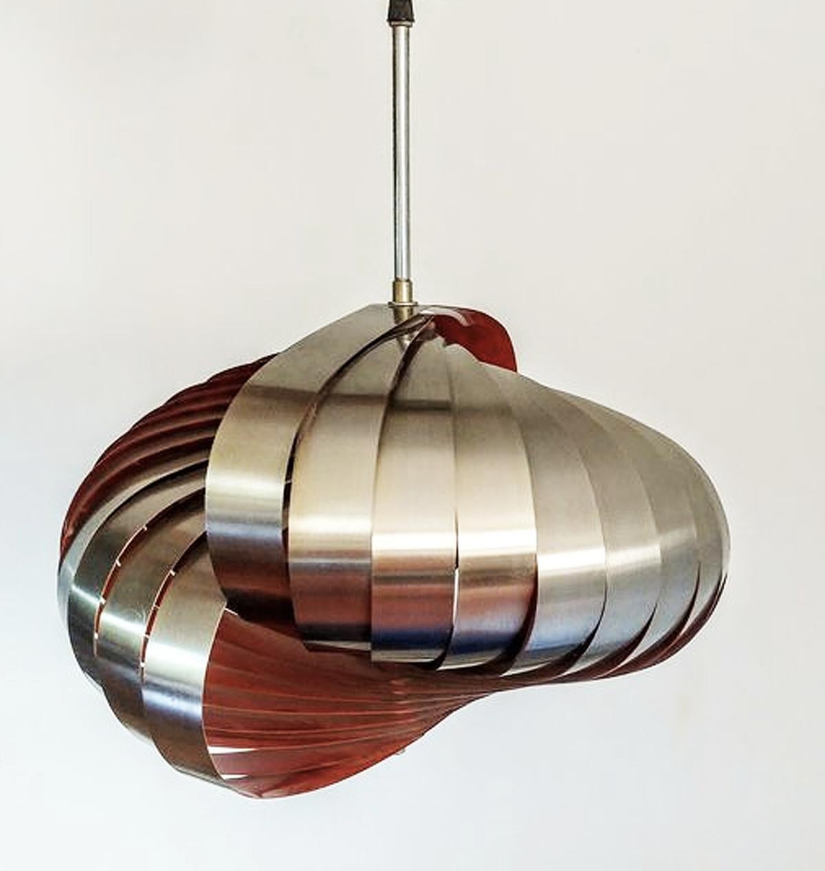 Stainless steel pendant light by Henri Mathieu. France 1970s. Great lines and design a very modern design even now. Silver steel on the outside, and orange on the inside. Giving a beautiful glow when on. 
The lamp uses x 2 E27 lamp bulbs... in good