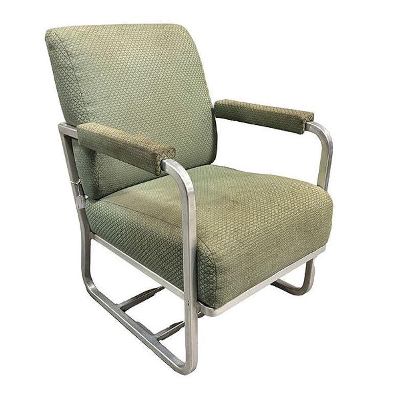 This pair of Art Deco aluminum lounge chairs was acquired from a Pullman passenger train remodeled in the 1960s. The chairs feature elegant tubular aluminum frames and original forest-green upholstery, which adds a touch of vintage charm. Perfect