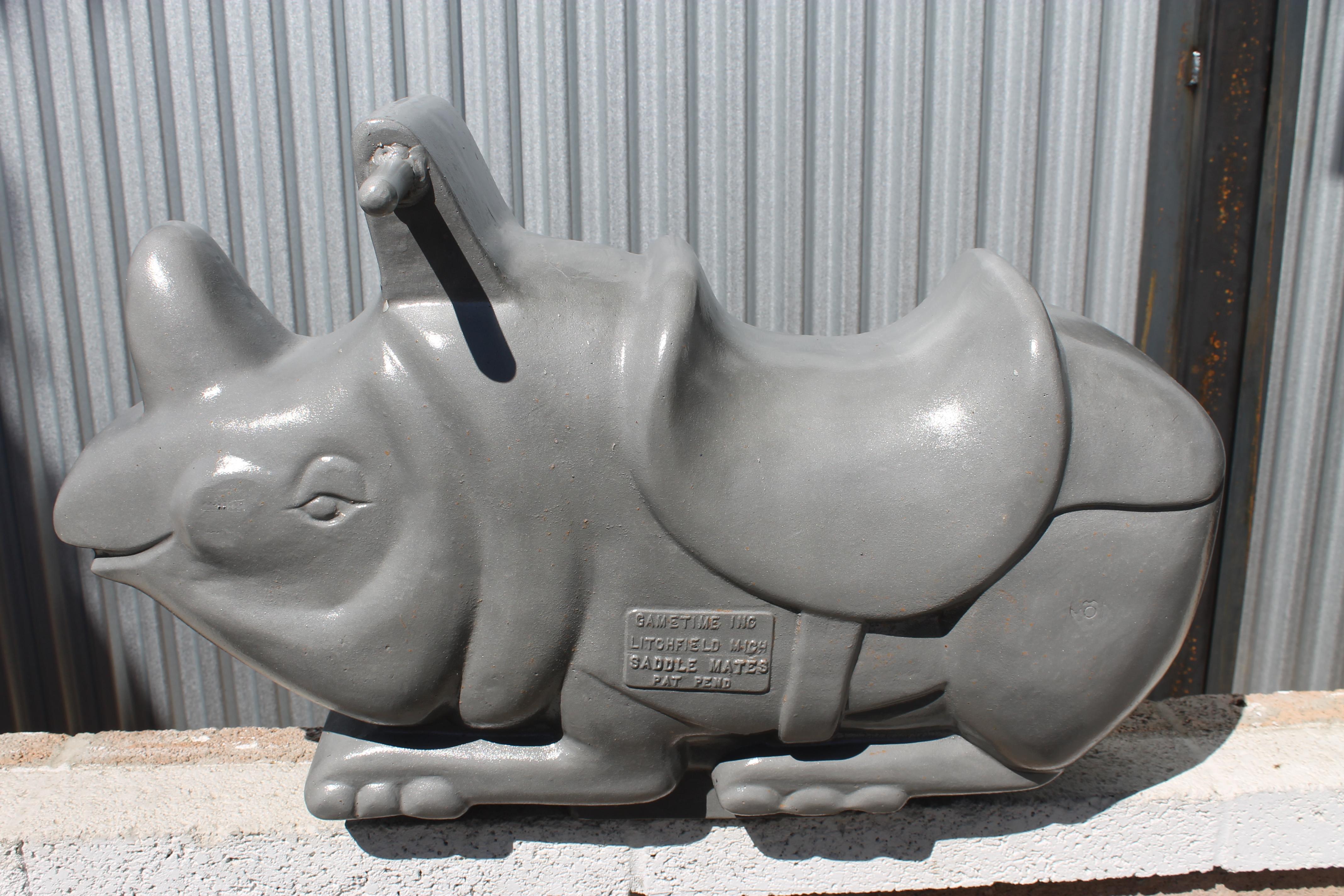 This aluminum rhino sculpture was originally a playground spring ride located throughout parks. Spring is not included. It's more sculptural and part of Americana history. We had it sand blasted and clear coated. Rhino measures 29