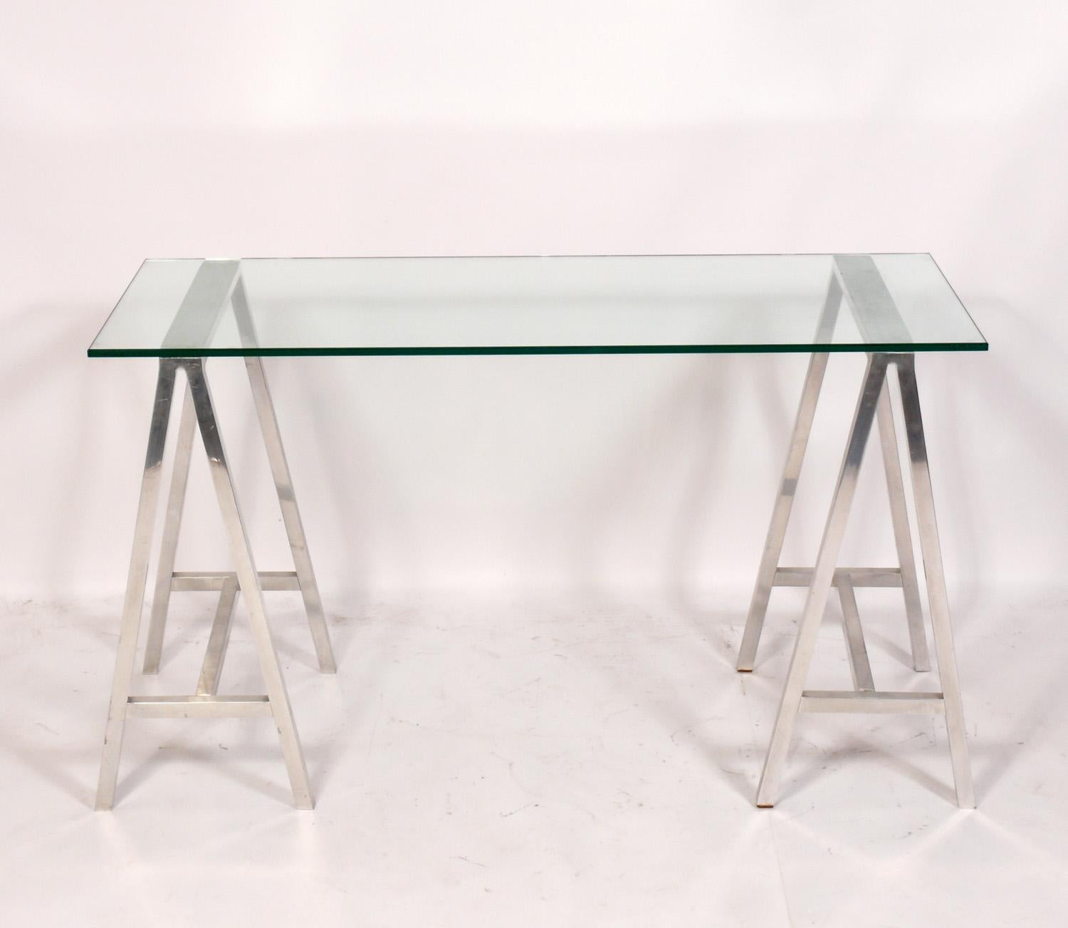 Modernist aluminum and glass console table or desk, American, circa 1960s. This piece is a versatile size and can be used as a console table, desk, vanity, bar, or media table.