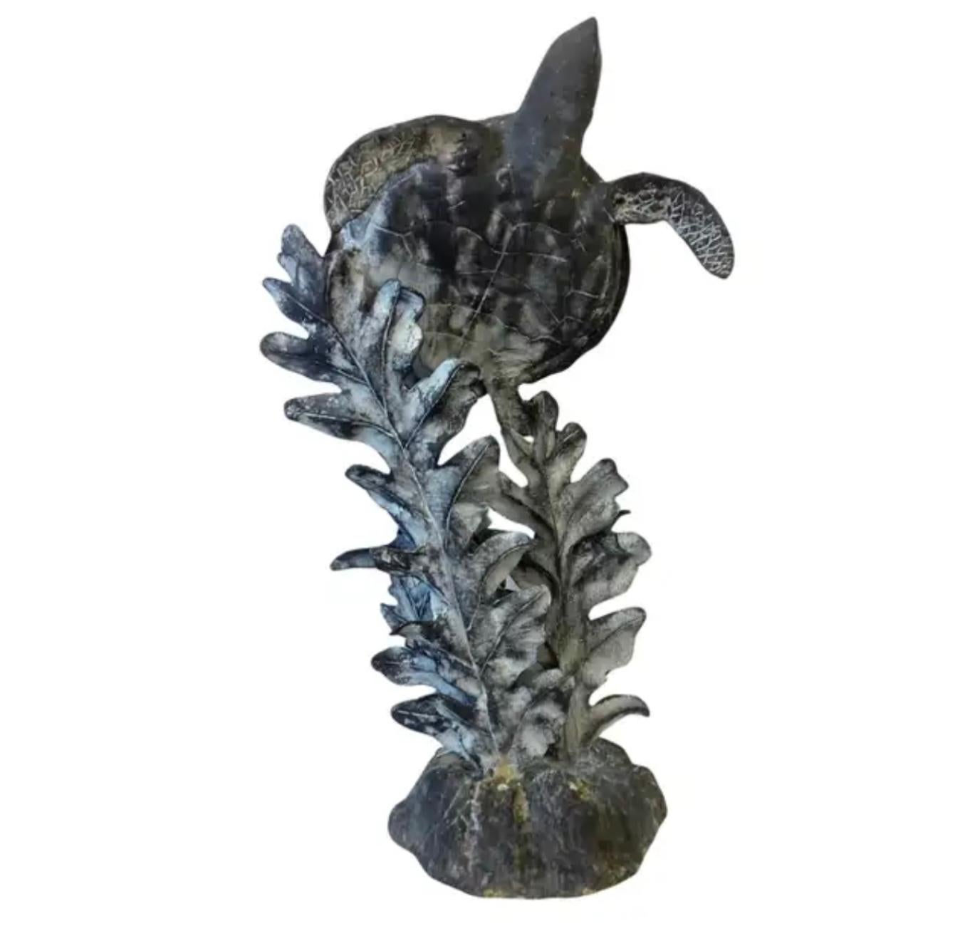 Charming 20th century aluminum sea turtle sculpture depicting a larger and a small sea turtle, several fish, and sea foliage on a large sea reef base. A perfect addition to any nautical or coastal themed decor. 