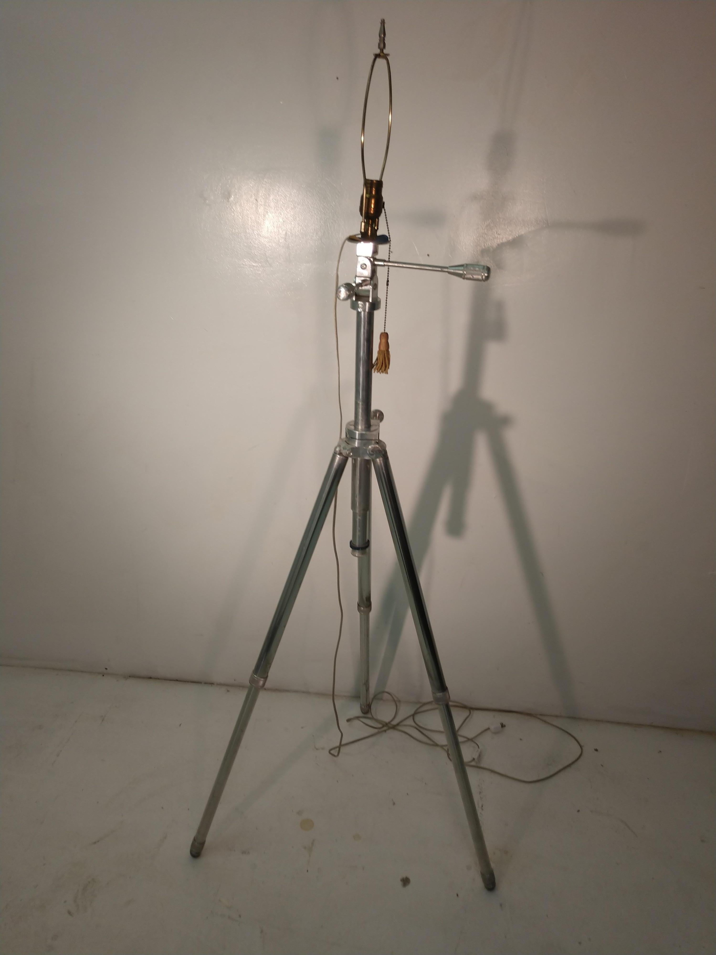 Fabulous converted telescoping camera stand into a floor lamp. Measurements given are for photos, this lamp is fully adjustable and even the top portion can be tilted. Shade is damaged on one side so not included. Stand is all milled aluminum.