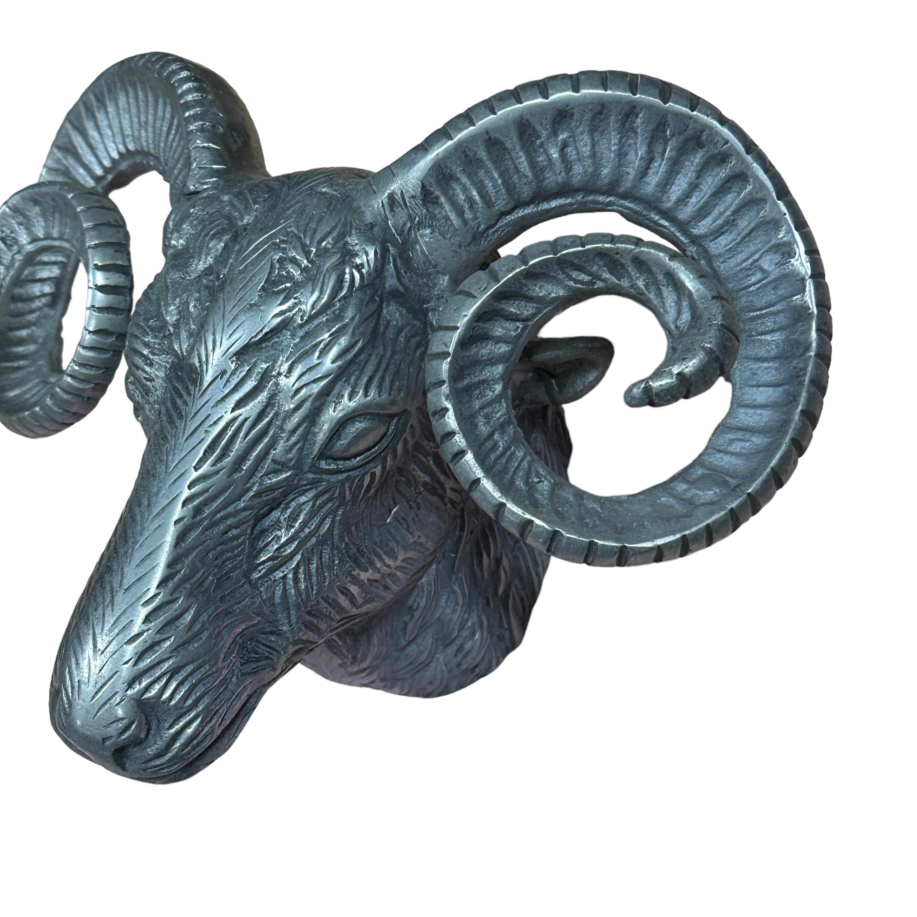 A great looking Ram head wall decoration. Bring a touch of Opulence into your home with this aluminum, wall mountable Ram head. This head has an industrial feel which would catch eyes in any living room or hallway. Made in the style of Arthur Court,