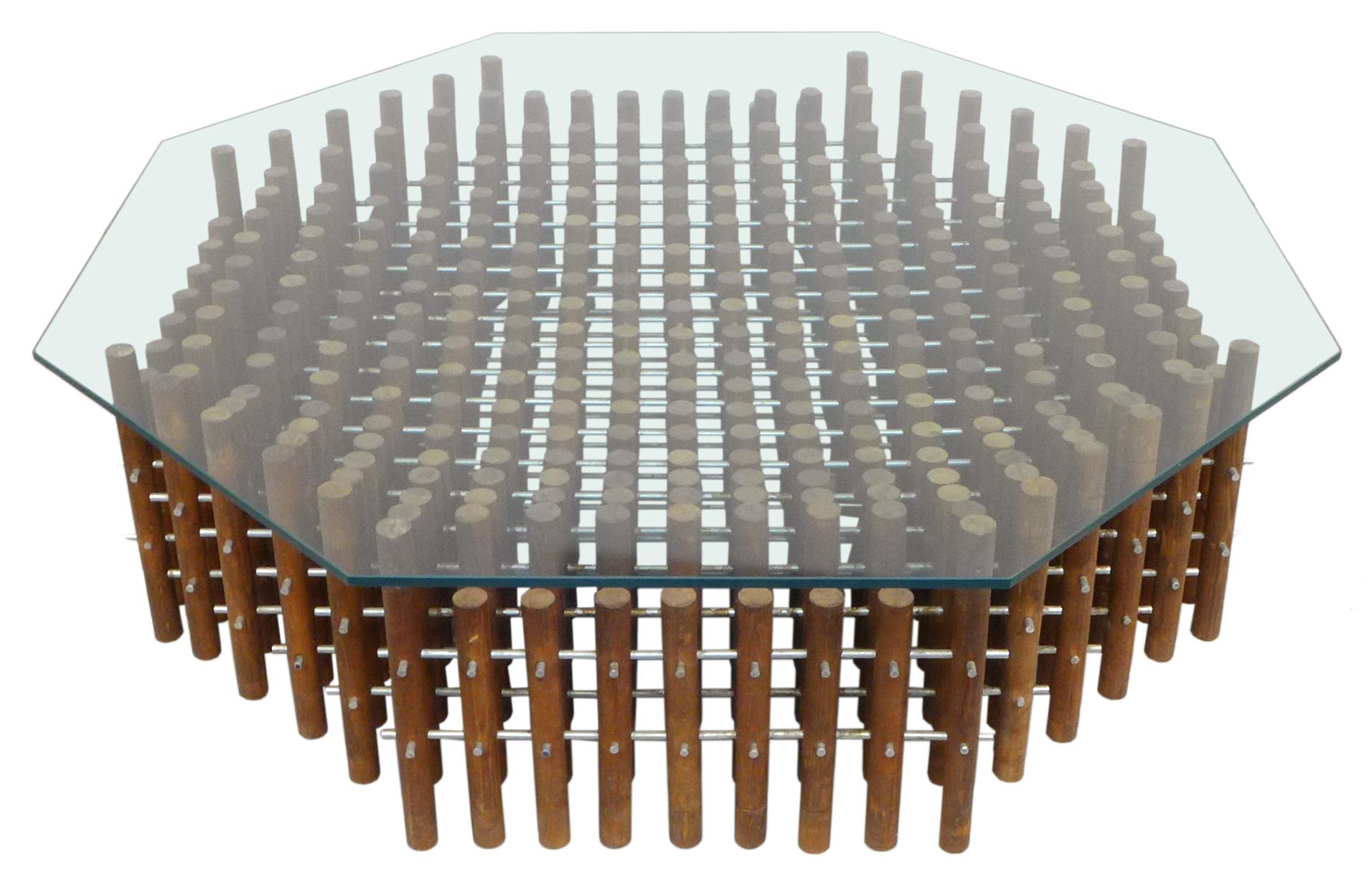 A fantastic aluminum, wood, and glass hexagonal coffee table. An unexpected and wonderfully, thoroughly constructed item; a large, hexagonal assemblage of dozens of undulating, vertical, 1