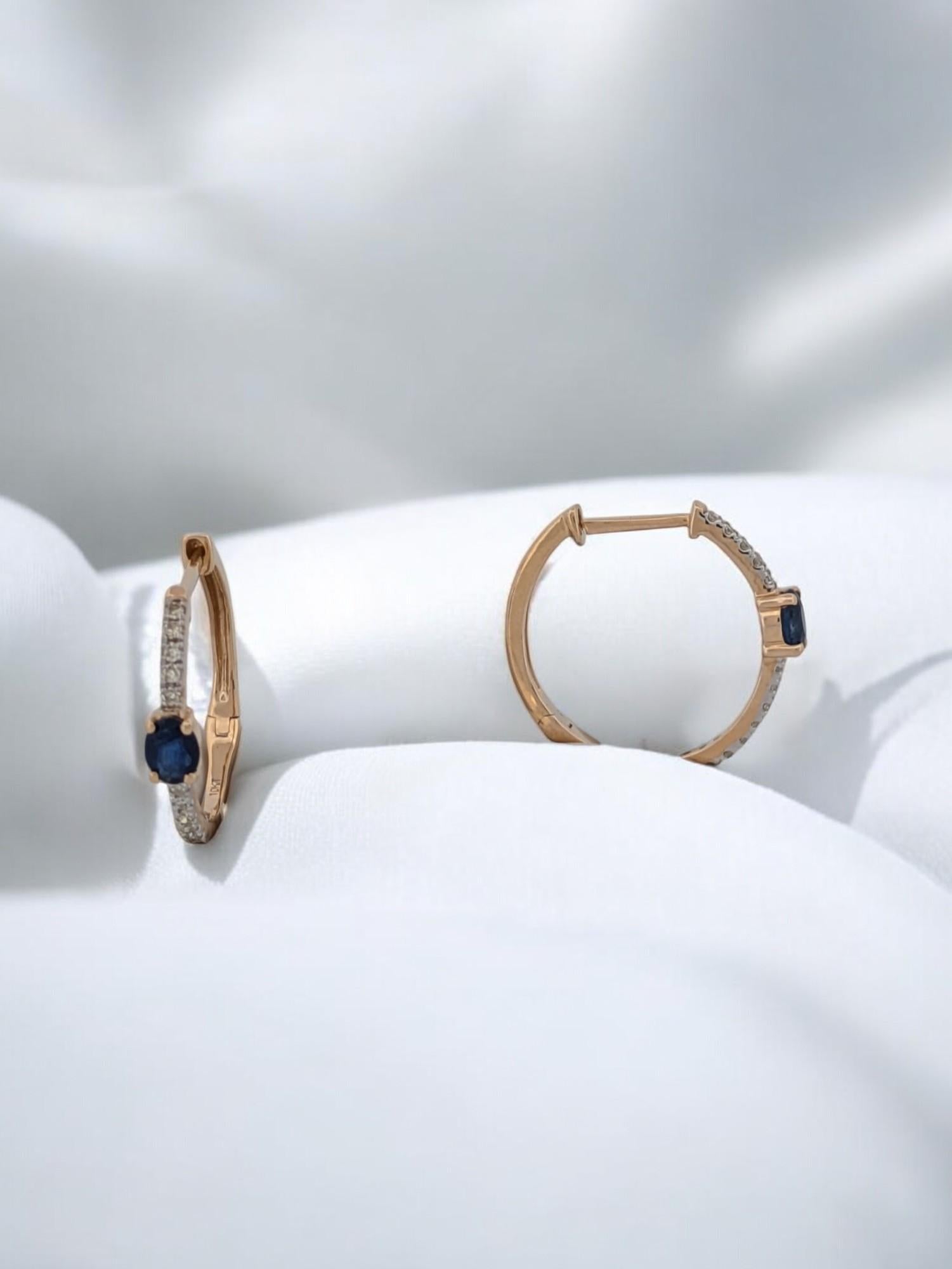 These exquisite 10K yellow gold hinge hoop earrings feature 0.45-carat sapphires accented by 0.15-carat natural diamonds, creating a timeless and elegant look. Perfect for daily wear, special occasions, or as a luxurious gift, these earrings are a