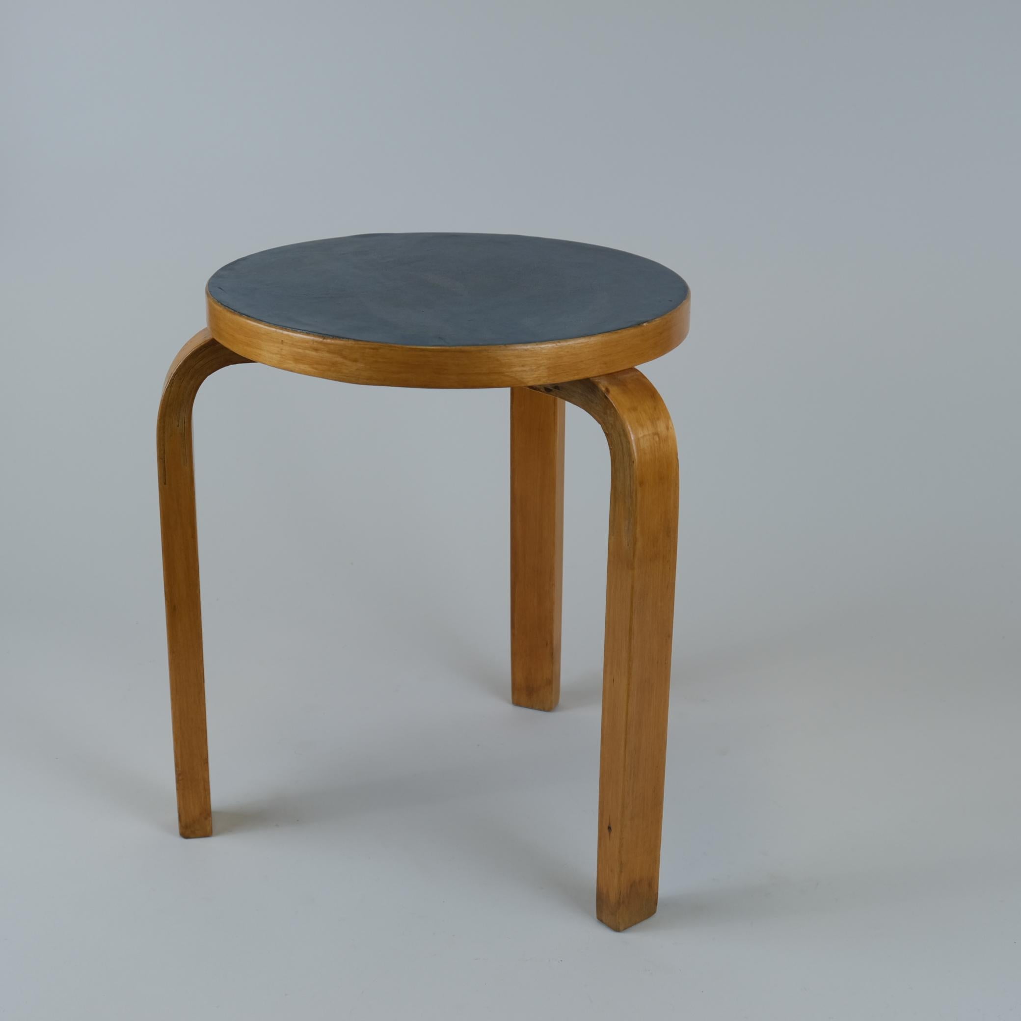 Artek stool in birch and blue linoleum, designed by Alvar Aalto and manufactured by Artek in the 1950s. The model 60 stool is perhaps the most well known Aalto design and has always been attractive to people. As with a lot of Alvar Aalto's works the