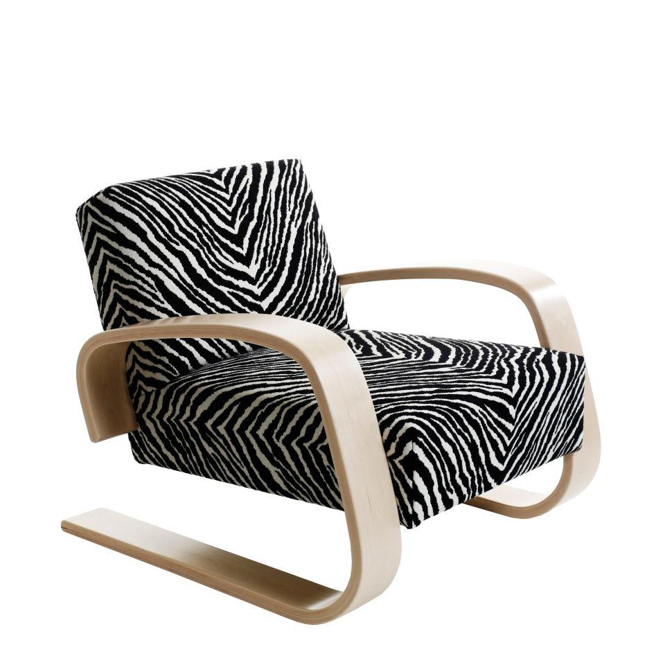 Alvar Aalto 400 ‘Tank’ armchair for Artek. Designed in 1936. New, current production. Please note: price is for a 'Tank' armchair in Zebra upholstery and natural lacquered armrests.

As voluminous as it is comfortable, Armchair 400 was created by