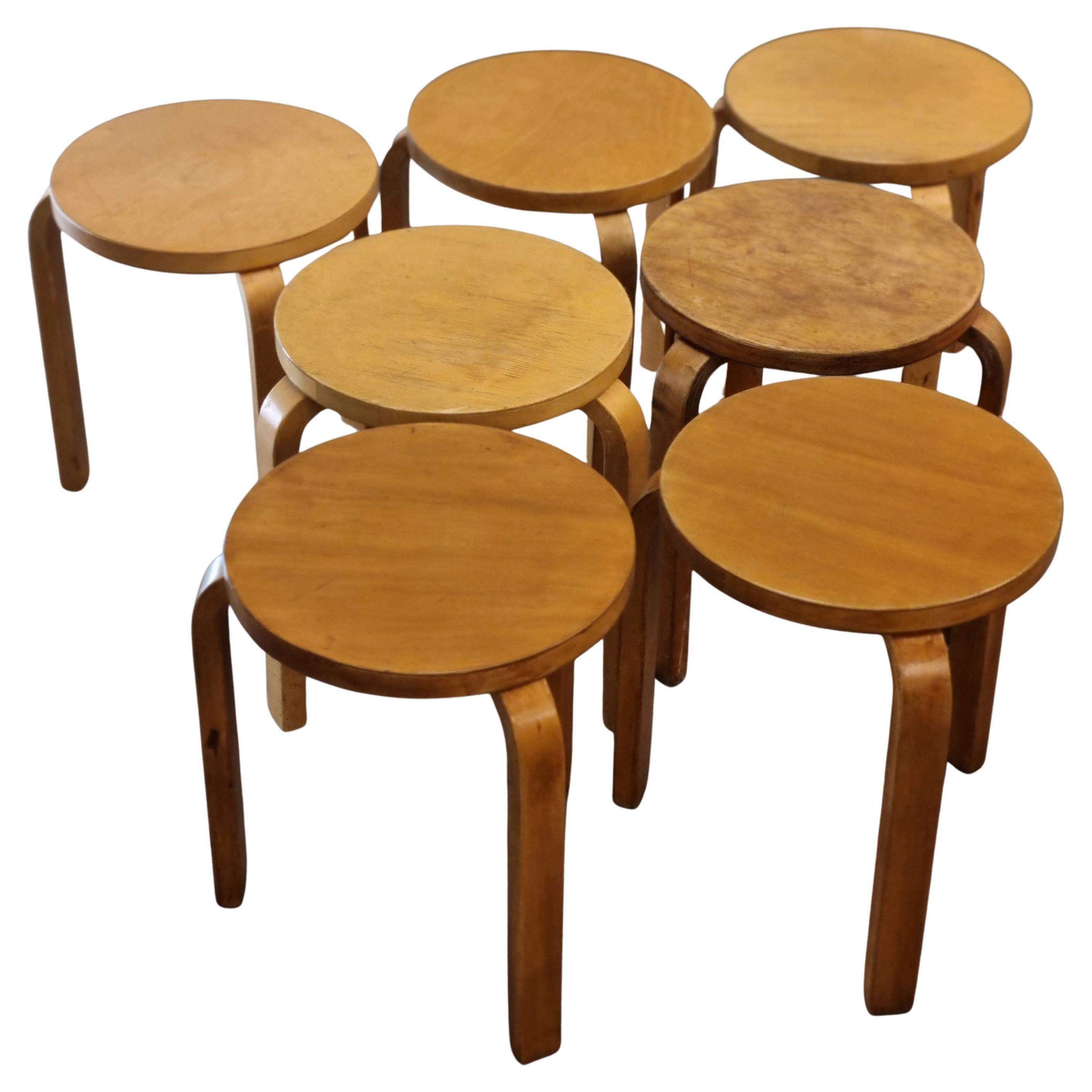 These seven Alvar Aalto iconic stools from 1930s are beautiful and space saving furniture pieces of timeless design. The legs are mounted directly to the underside of the round seat without the need for complicated connecting elements. The stools