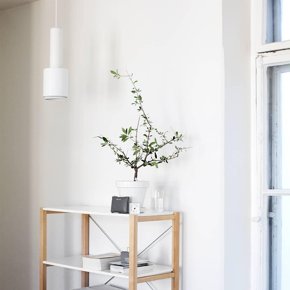 Alvar Aalto A110 'Hand Grenade' white pendant light for Artek. Produced by its original manufacturer, Artek of Finland. Executed in white painted metal and ring with white painted interior and 13 feet of white cord and ceiling canopy. UL listed.